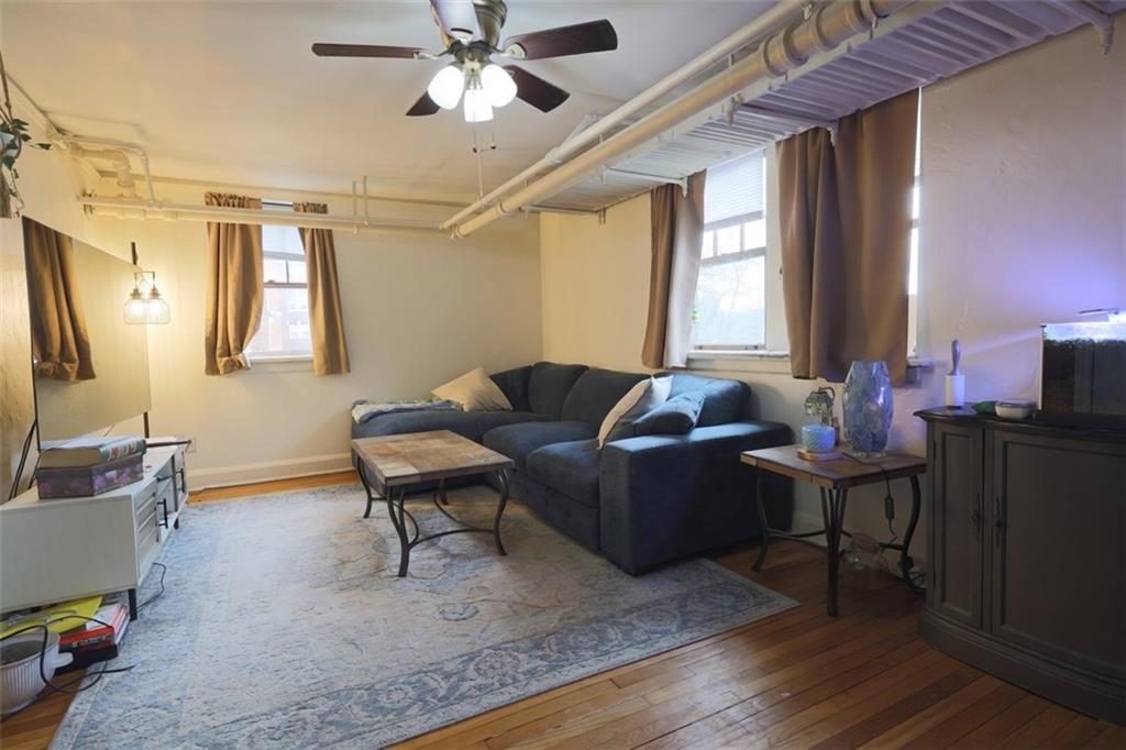 50 Academy Avenue, Unit 31 Pittsburgh, PA 15228 - Photo 4 of 13 a living room with furniture and wooden floor