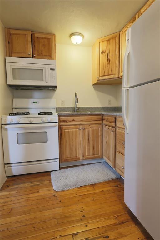 50 Academy Avenue, Unit 31 Pittsburgh, PA 15228 - Photo 5 of 13 a kitchen with stainless steel appliances granite countertop a stove a sink and a refrigerator