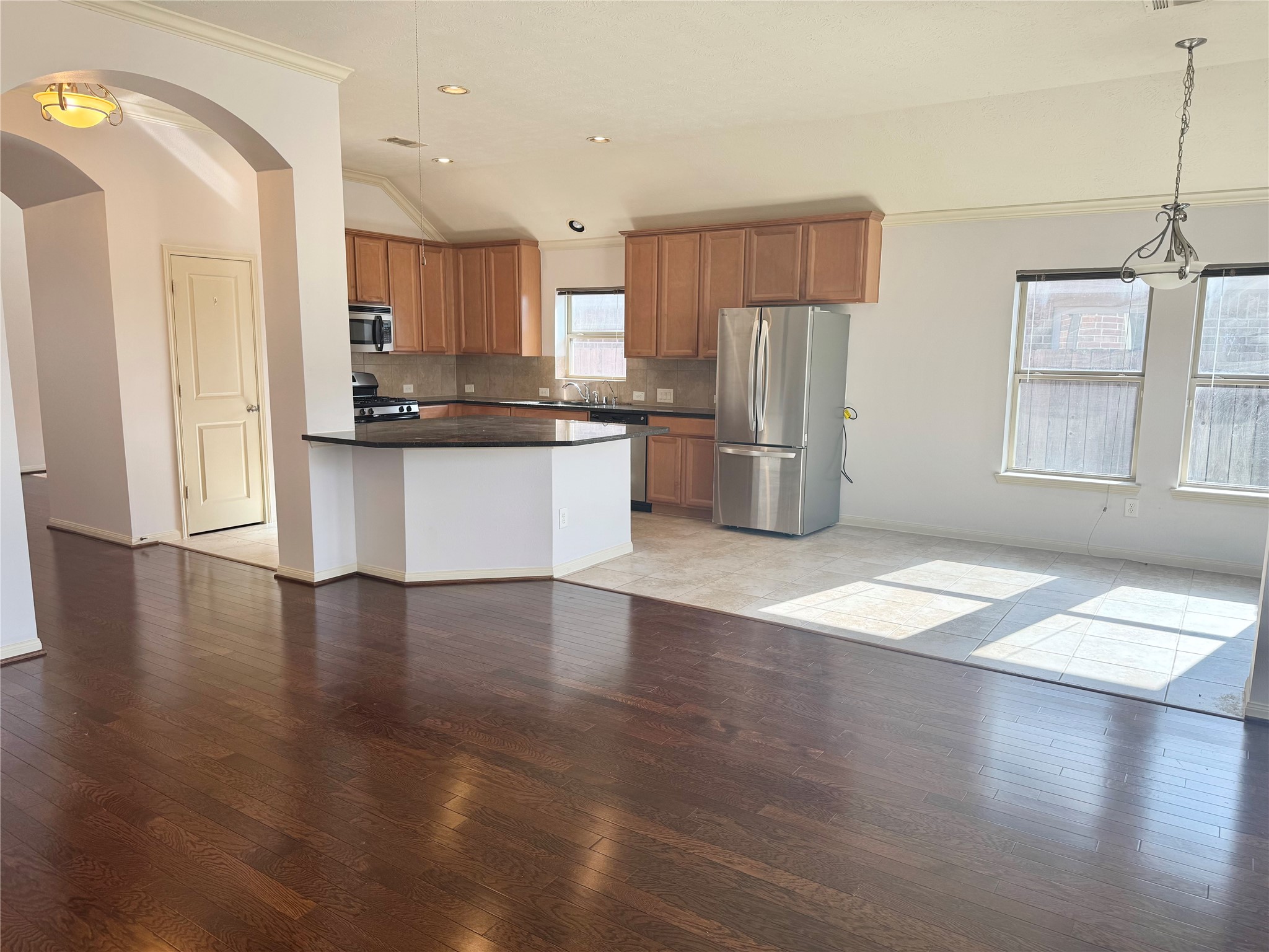 12407 Point Arbor Court Tomball, TX 77377 - Photo 11 of 18 a kitchen with stainless steel appliances a refrigerator sink and cabinets
