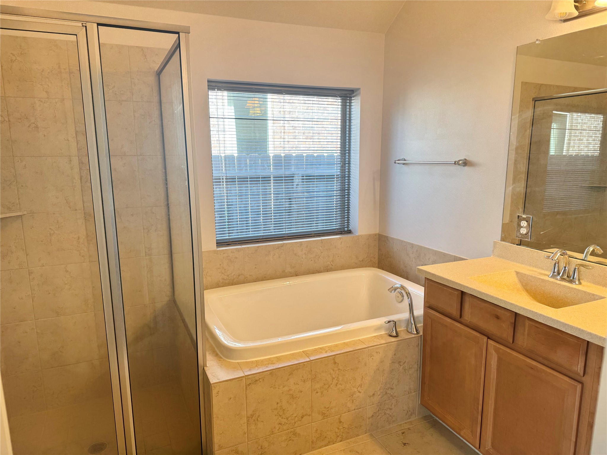 12407 Point Arbor Court Tomball, TX 77377 - Photo 13 of 18 a bathroom with a tub and sink