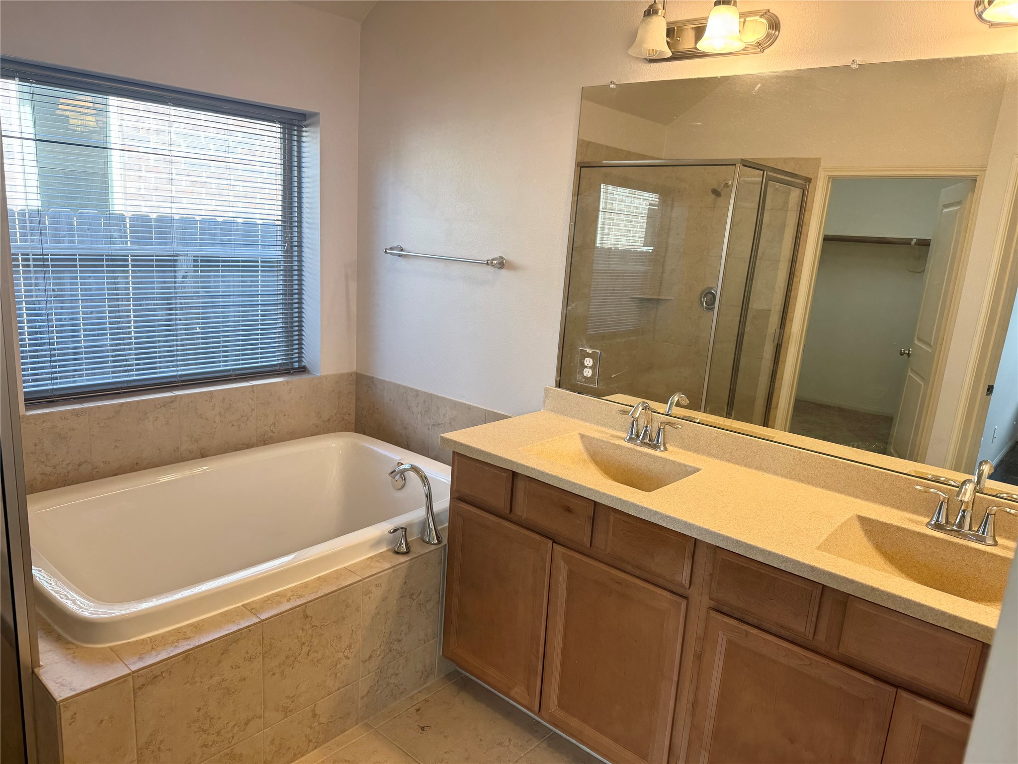 12407 Point Arbor Court Tomball, TX 77377 - Photo 14 of 18 a bathroom with a tub sink and mirror