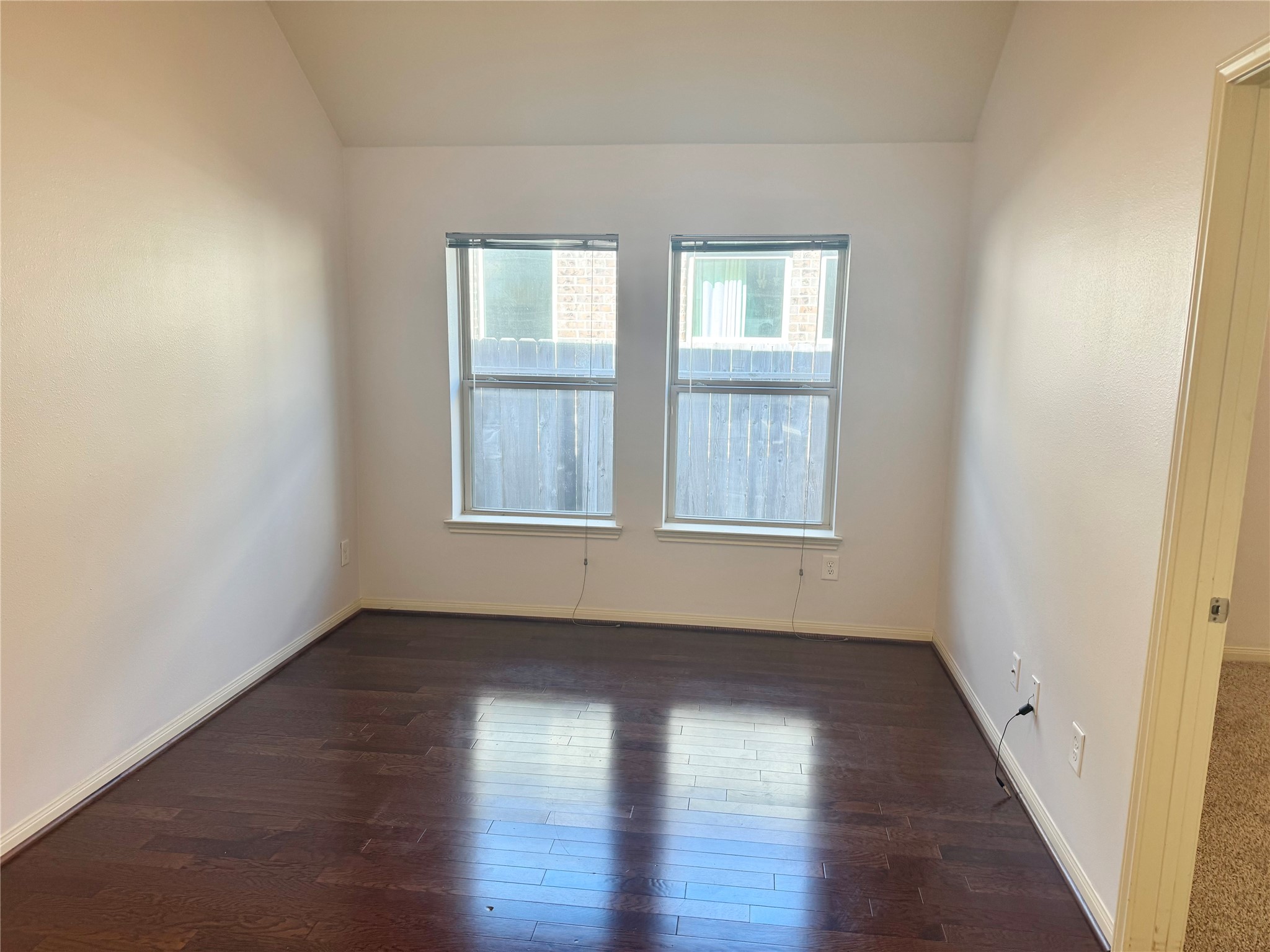 12407 Point Arbor Court Tomball, TX 77377 - Photo 15 of 18 an empty room with wooden floor and windows