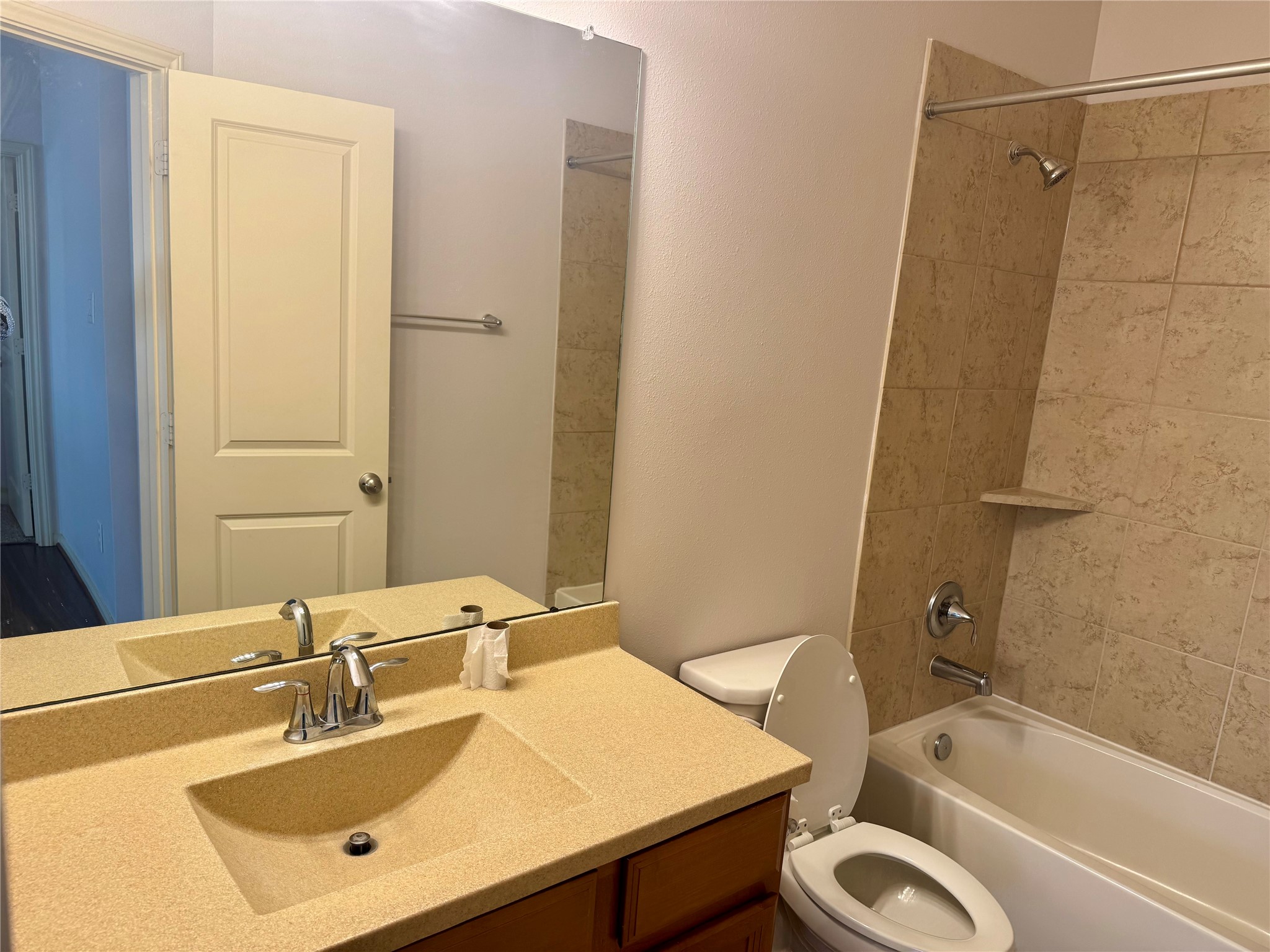 12407 Point Arbor Court Tomball, TX 77377 - Photo 17 of 18 a bathroom with a granite countertop sink toilet and shower