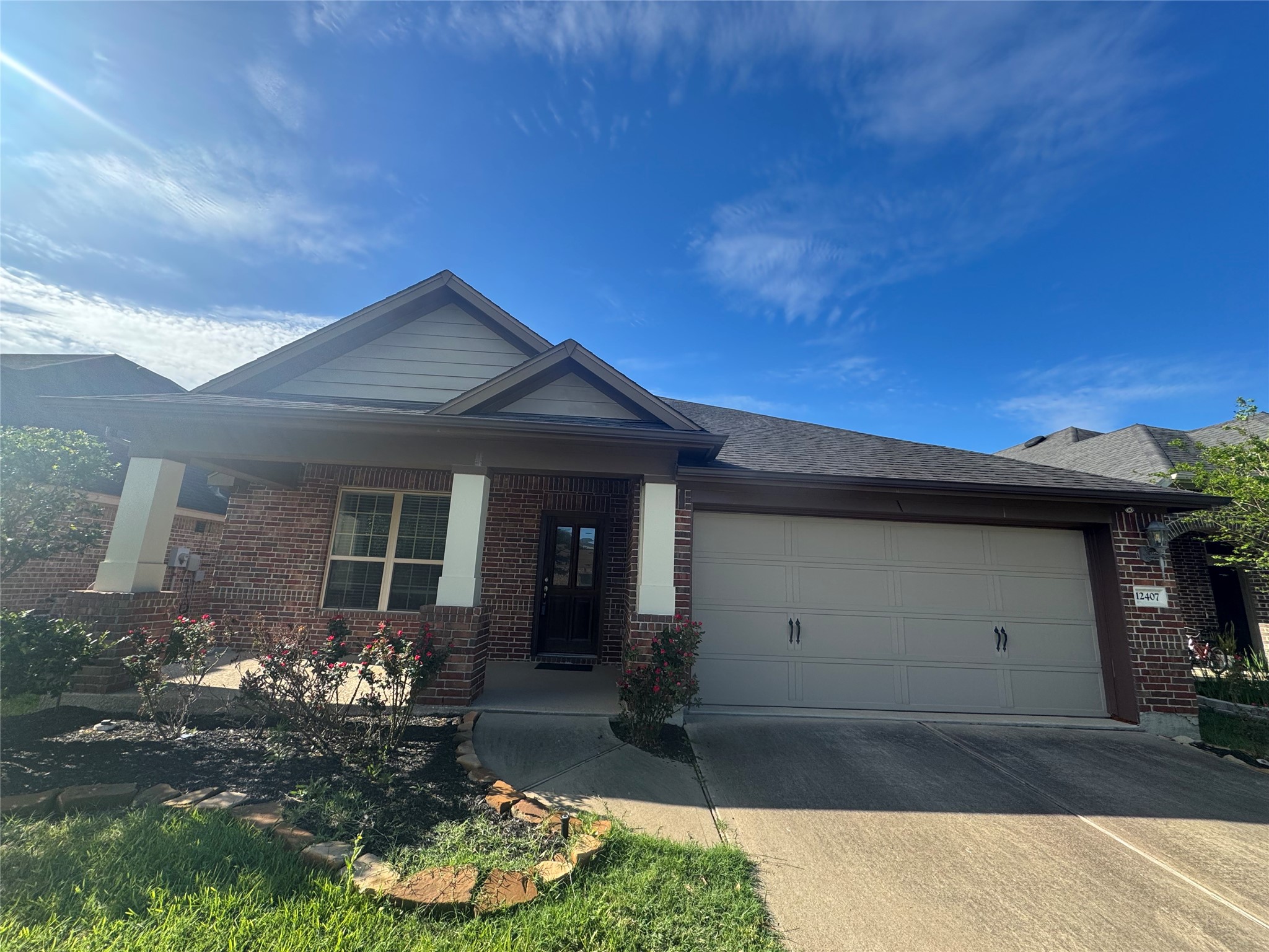 12407 Point Arbor Court Tomball, TX 77377 - Photo 2 of 18 a front view of a house with a garden