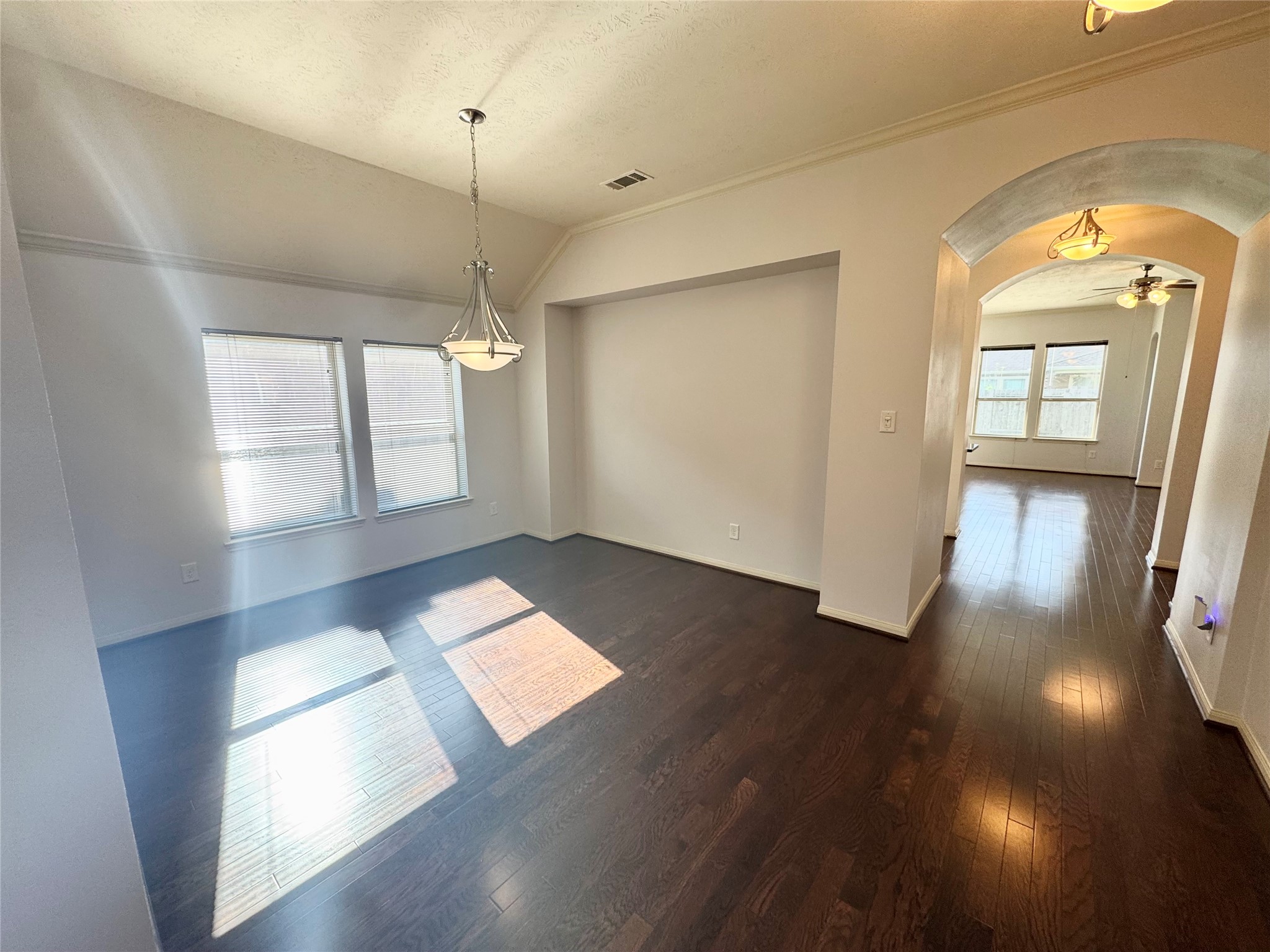 12407 Point Arbor Court Tomball, TX 77377 - Photo 6 of 18 a view of empty room with wooden floor and fan