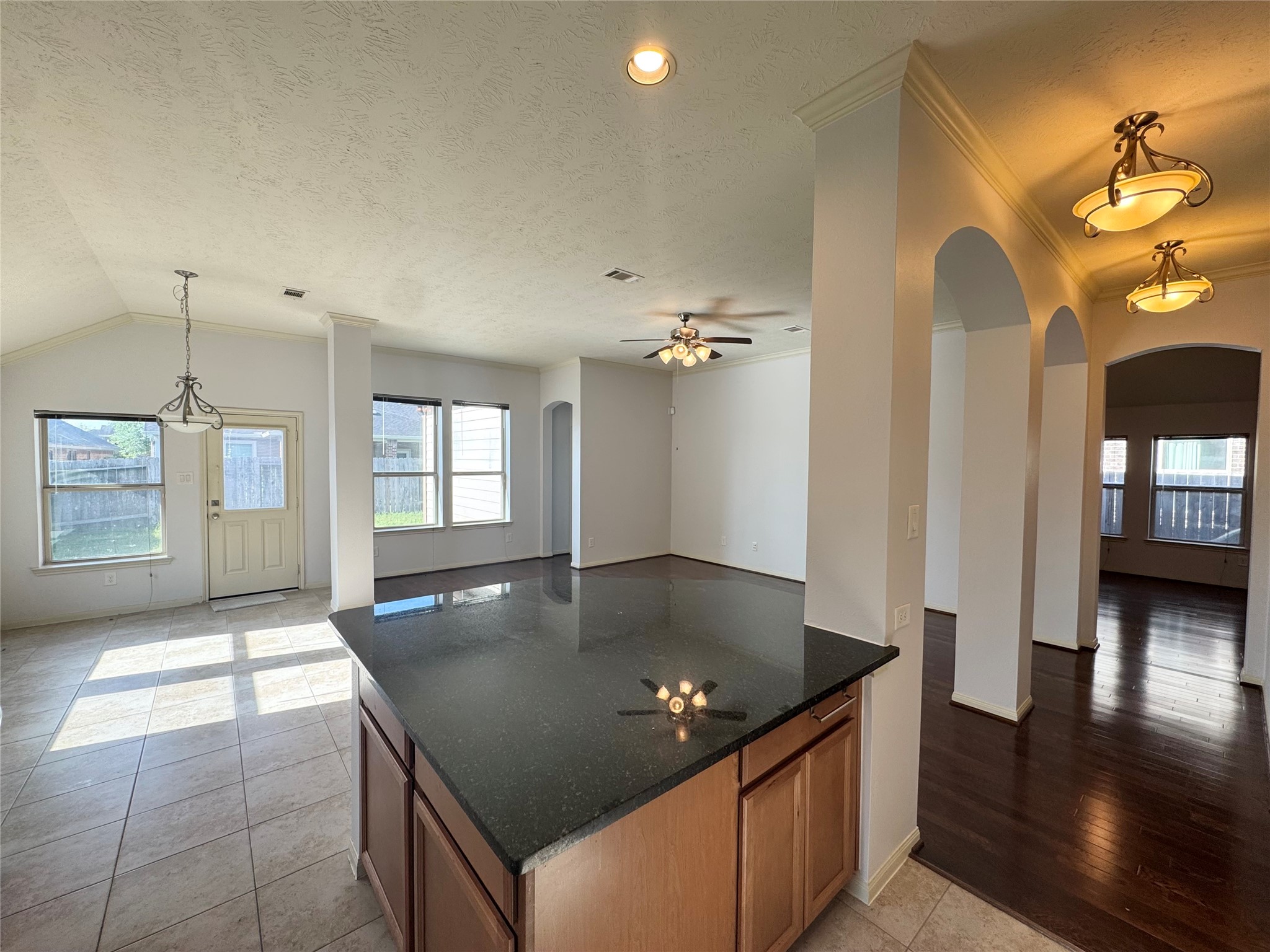 12407 Point Arbor Court Tomball, TX 77377 - Photo 8 of 18 a kitchen with granite countertop a sink a counter top space and cabinets