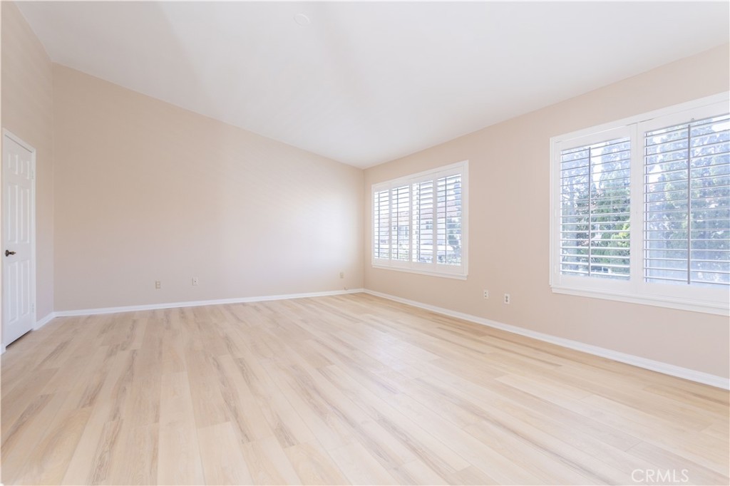 12067 Turtle Springs Court Porter Ranch, CA 91326 - Photo 21 of 34 an empty room with windows