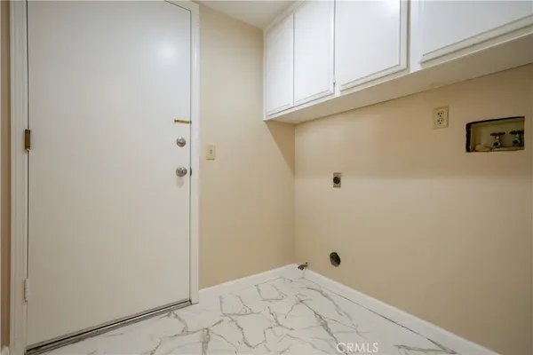 a view of an house with swimming pool and sitting area