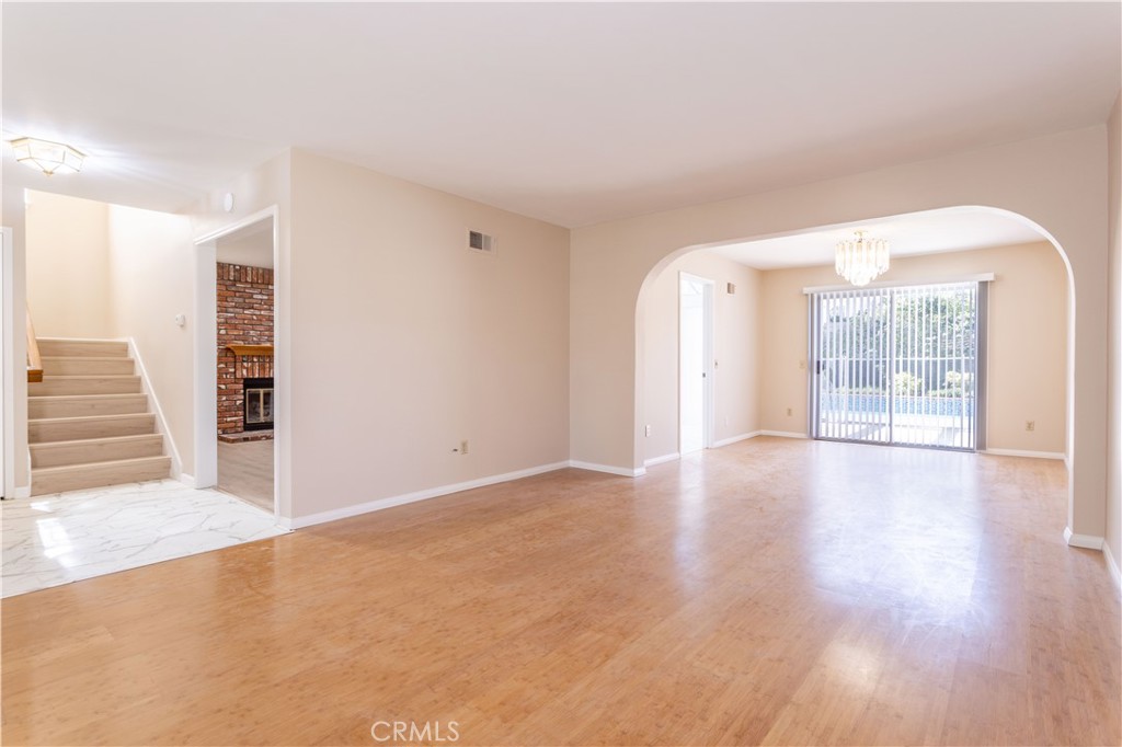 12067 Turtle Springs Court Porter Ranch, CA 91326 - Photo 8 of 34 an empty room with wooden floor and windows