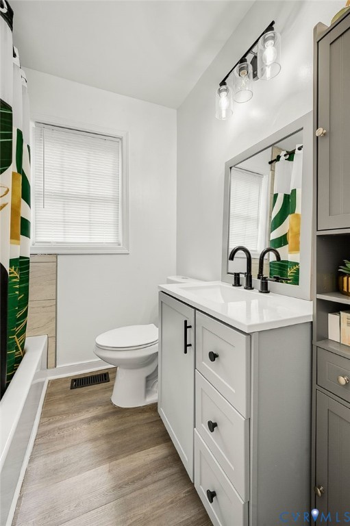 2909 Springview Drive Richmond, VA 23234 - Photo 15 of 19 a bathroom with a toilet sink and mirror