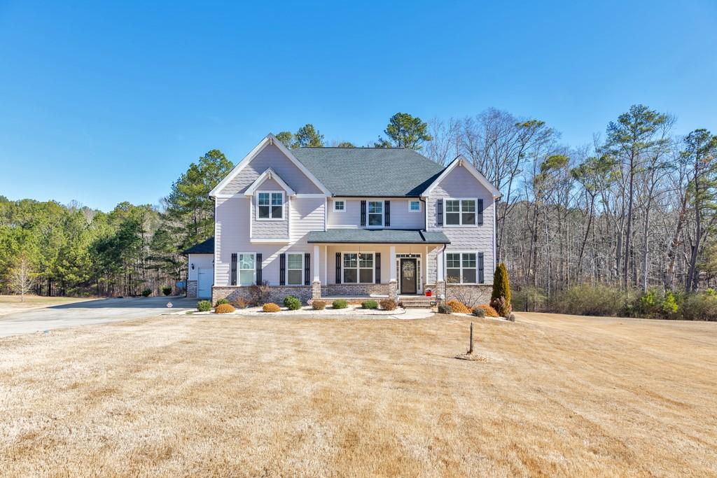 110 Sunflower Street Tyrone, GA 30290 - Photo 1 of 1 a front view of a house with a yard