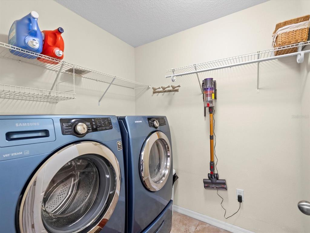 1716 Hadden Hall Place Trinity, FL 34655 - Photo 35 of 75 a utility room with dryer and washer