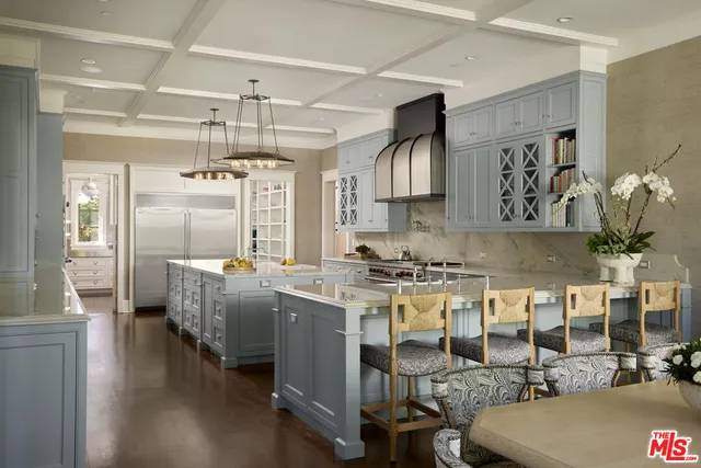 a kitchen with stainless steel appliances granite countertop a stove and refrigerator