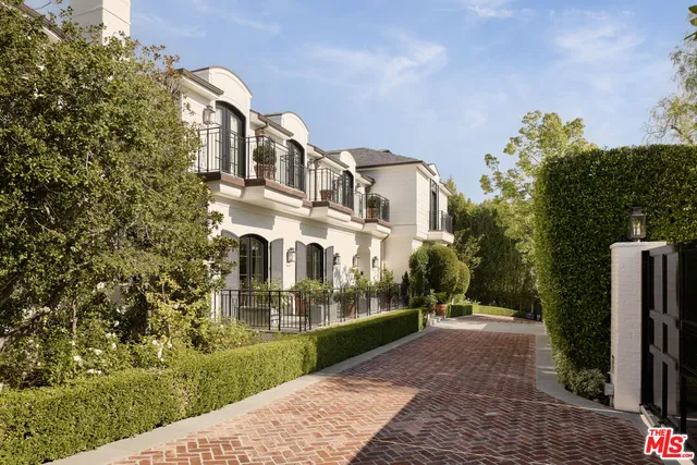 a view of a large building with a yard
