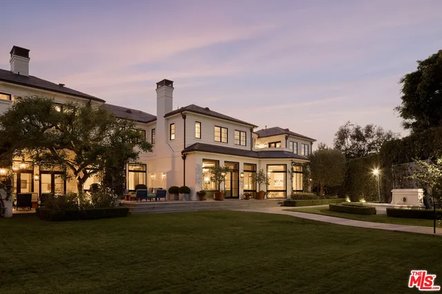a front view of a building with garden