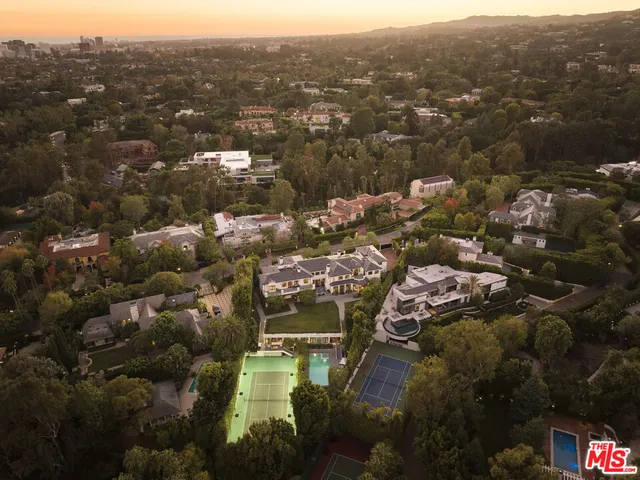 an aerial view of residential building with parking space