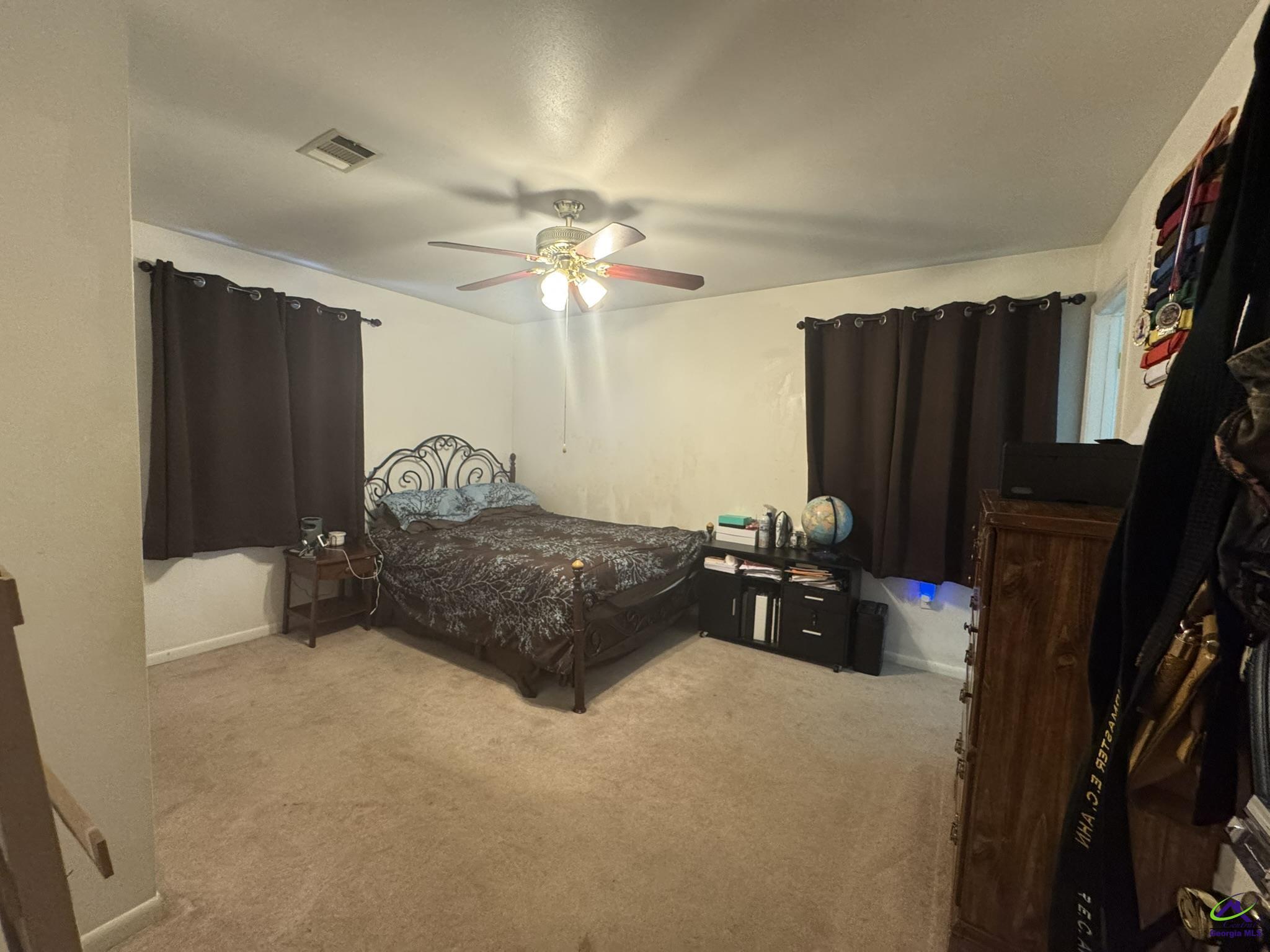 1032 Elberta Road Warner Robins, GA 31093 - Photo 13 of 26 a bedroom with a bed dresser and a window