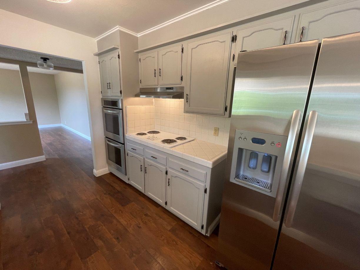 25187 Auberry Road Clovis, CA 93619 - Photo 11 of 58 a kitchen with stainless steel appliances a refrigerator and a stove