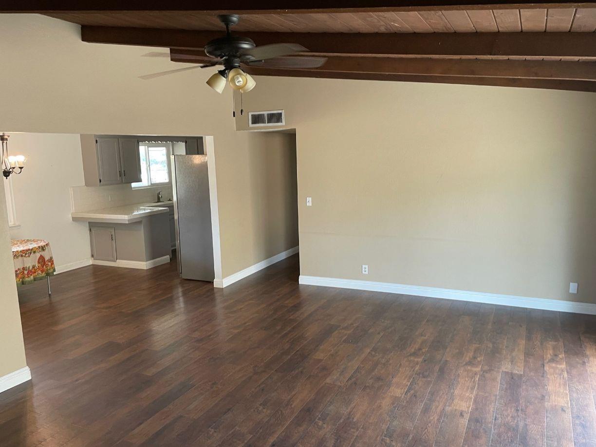25187 Auberry Road Clovis, CA 93619 - Photo 15 of 58 a view of a livingroom with a dishwasher and wooden floor