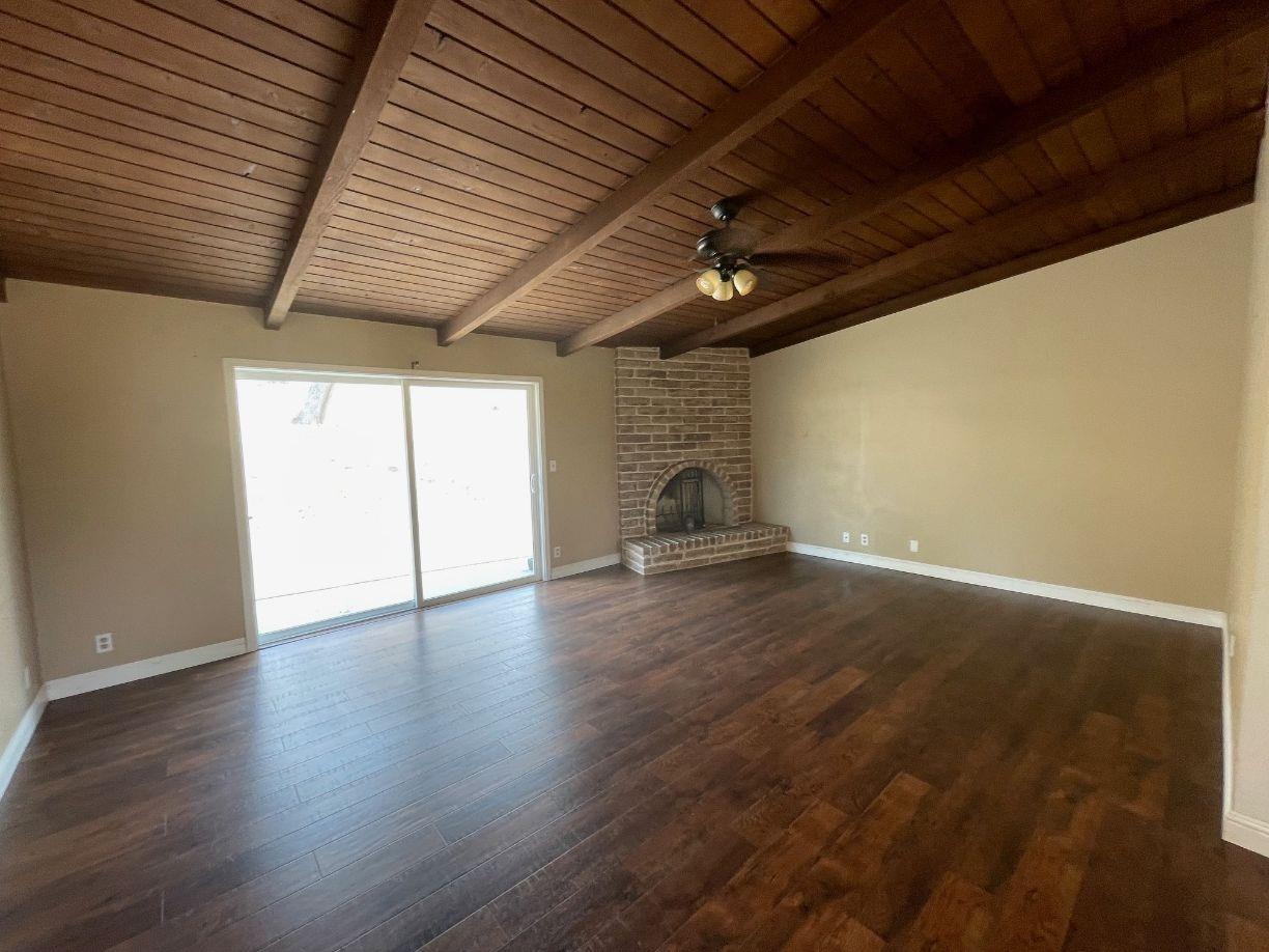 25187 Auberry Road Clovis, CA 93619 - Photo 16 of 58 a view of empty room with wooden floor