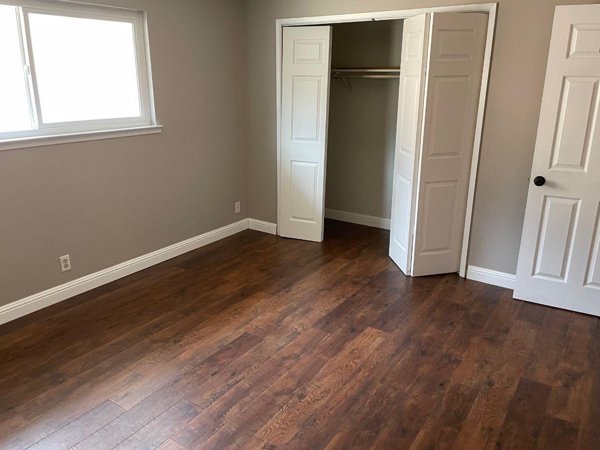 25187 Auberry Road Clovis, CA 93619 - Photo 26 of 58 an empty room with wooden floor and closet