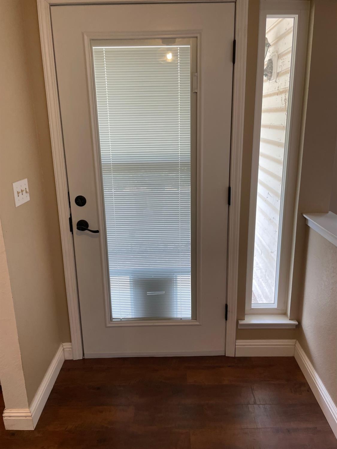 25187 Auberry Road Clovis, CA 93619 - Photo 48 of 58 an empty room with wooden floor and a window