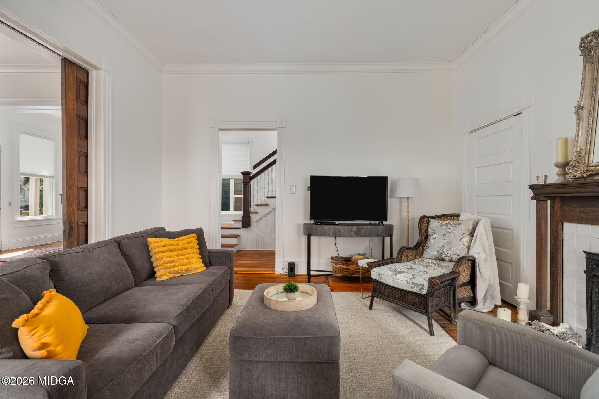 417 Orange Street Macon, GA 31201 - Photo 12 of 49 a living room with furniture and a flat screen tv