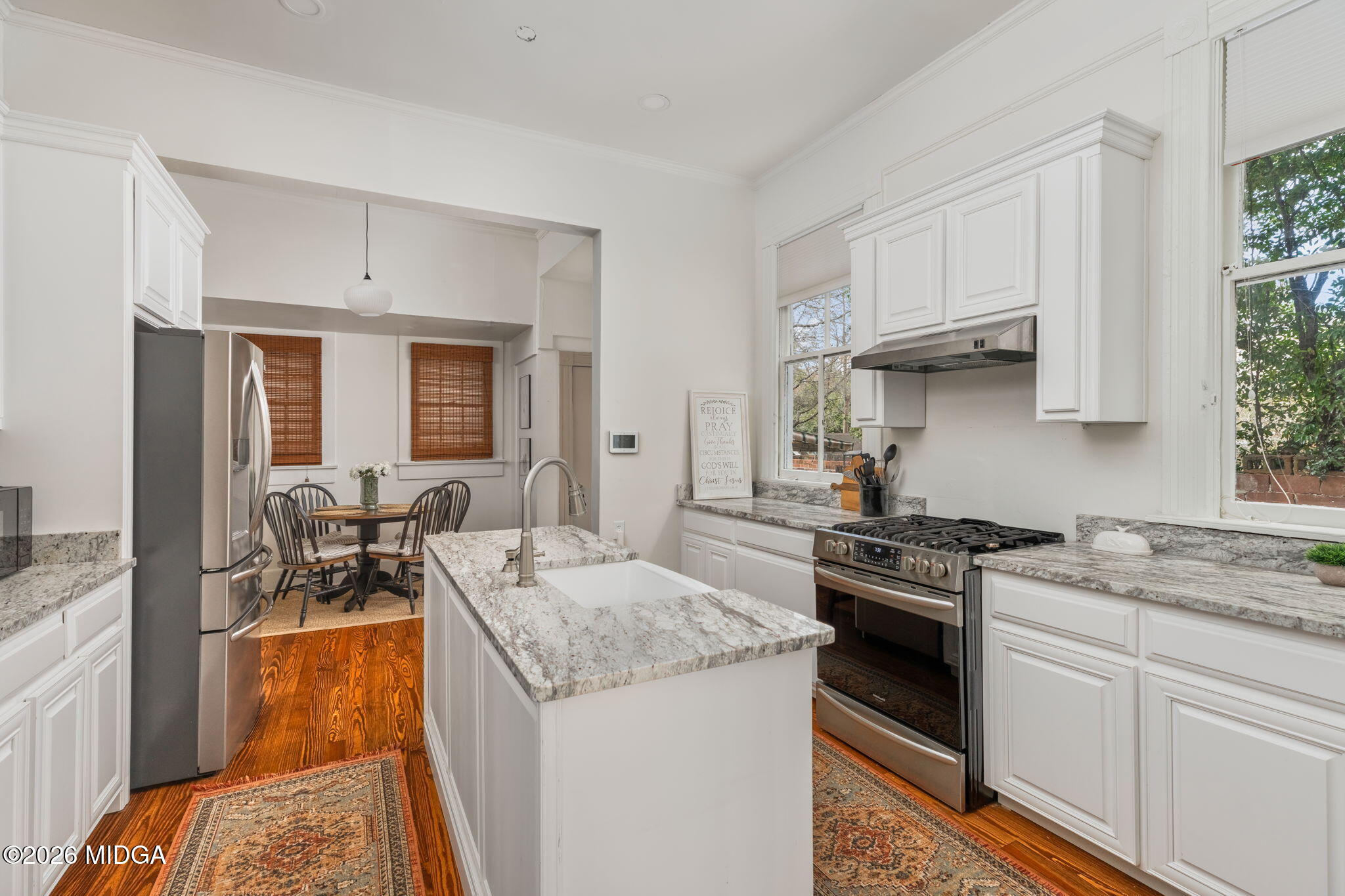 417 Orange Street Macon, GA 31201 - Photo 15 of 49 a kitchen with stainless steel appliances granite countertop a sink stove and refrigerator