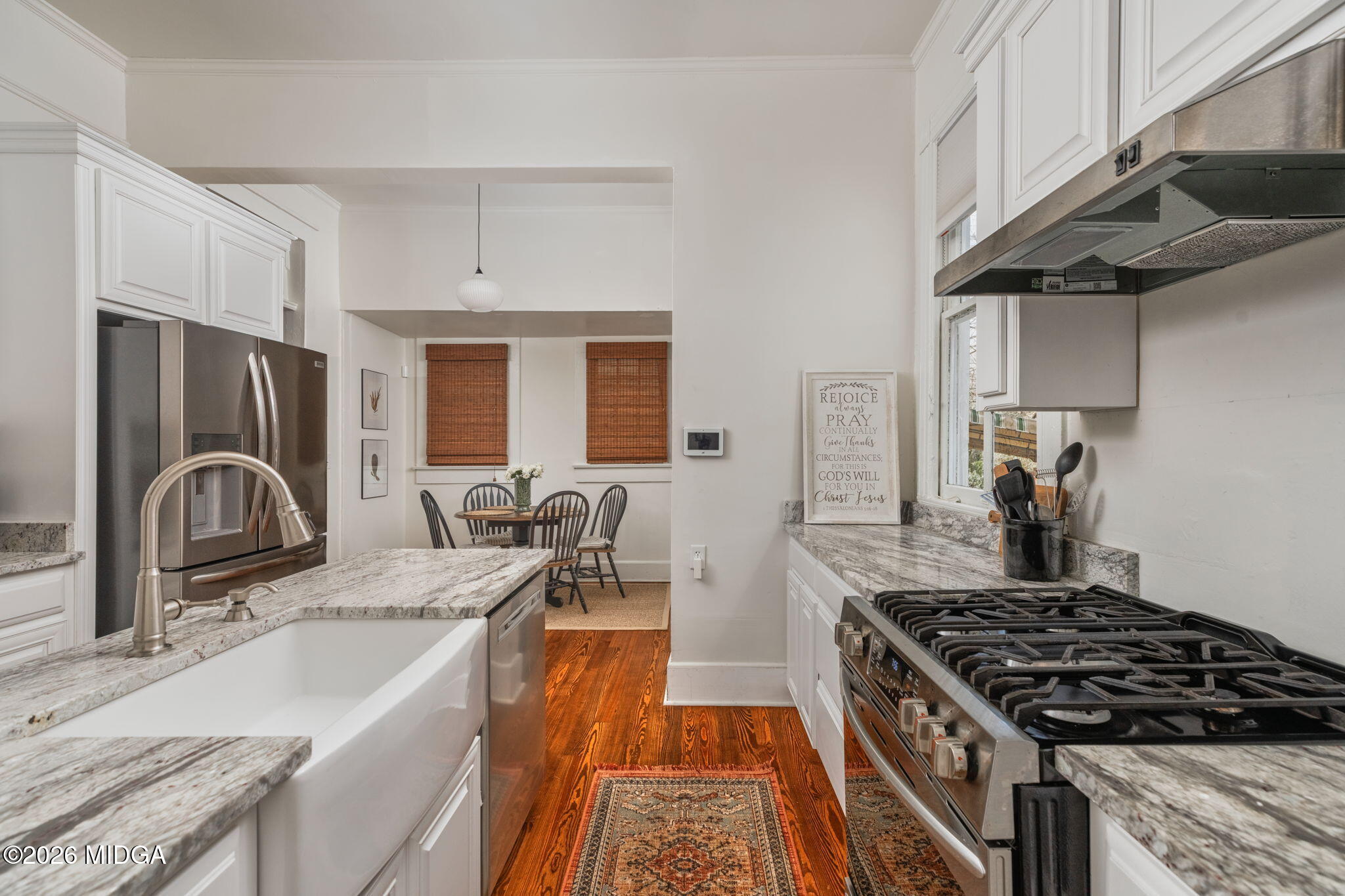 417 Orange Street Macon, GA 31201 - Photo 19 of 49 a kitchen with granite countertop a sink stove and refrigerator
