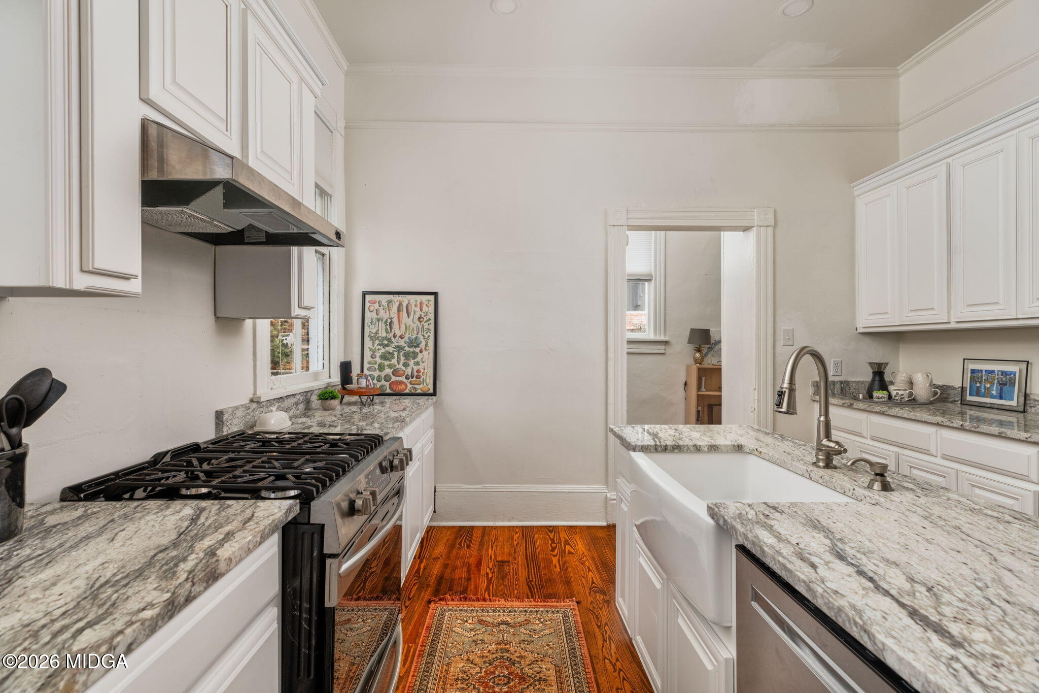 417 Orange Street Macon, GA 31201 - Photo 20 of 49 a kitchen with granite countertop stainless steel appliances and wooden cabinets