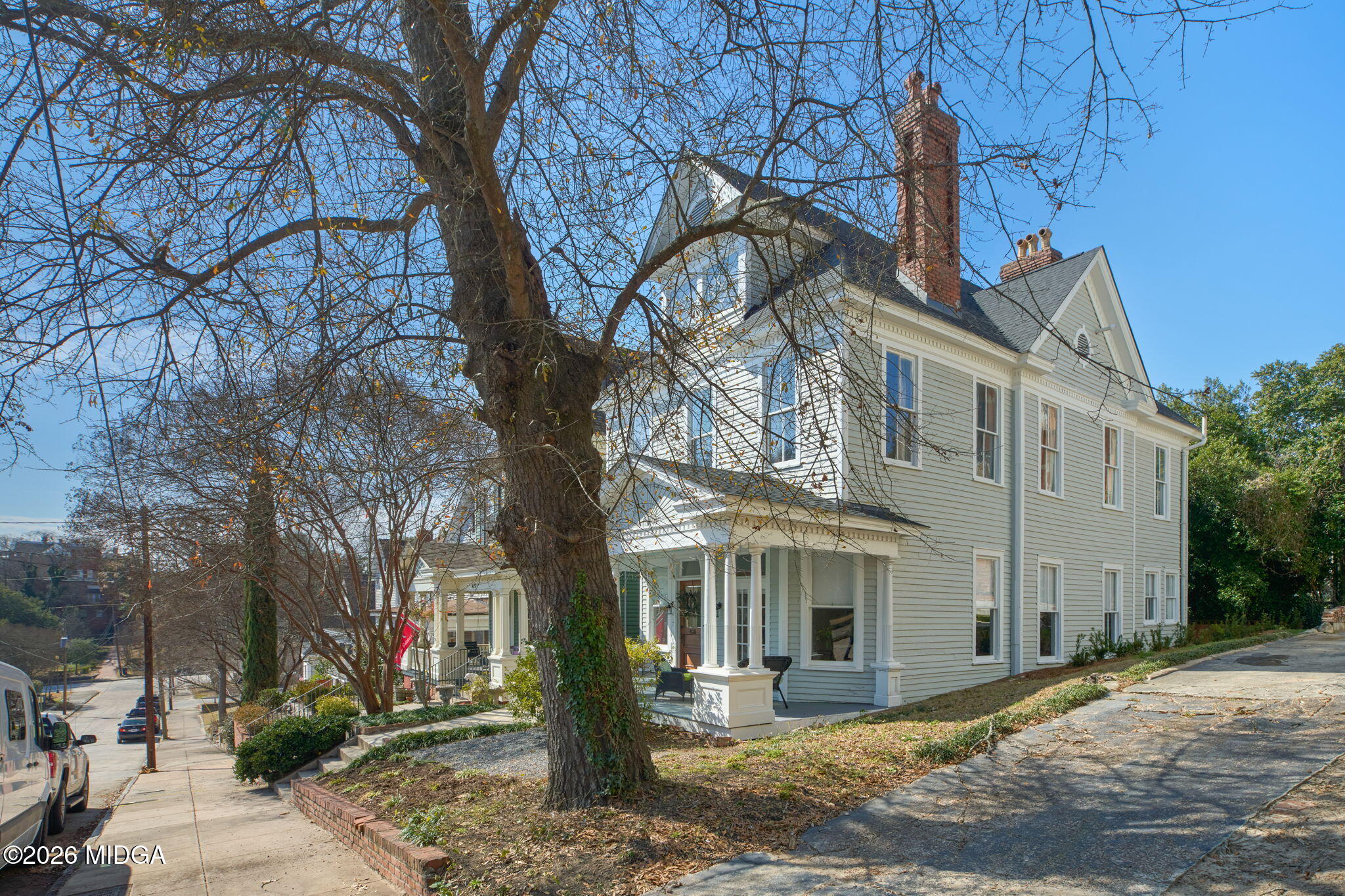 417 Orange Street Macon, GA 31201 - Photo 2 of 49 a front view of a house with a tree