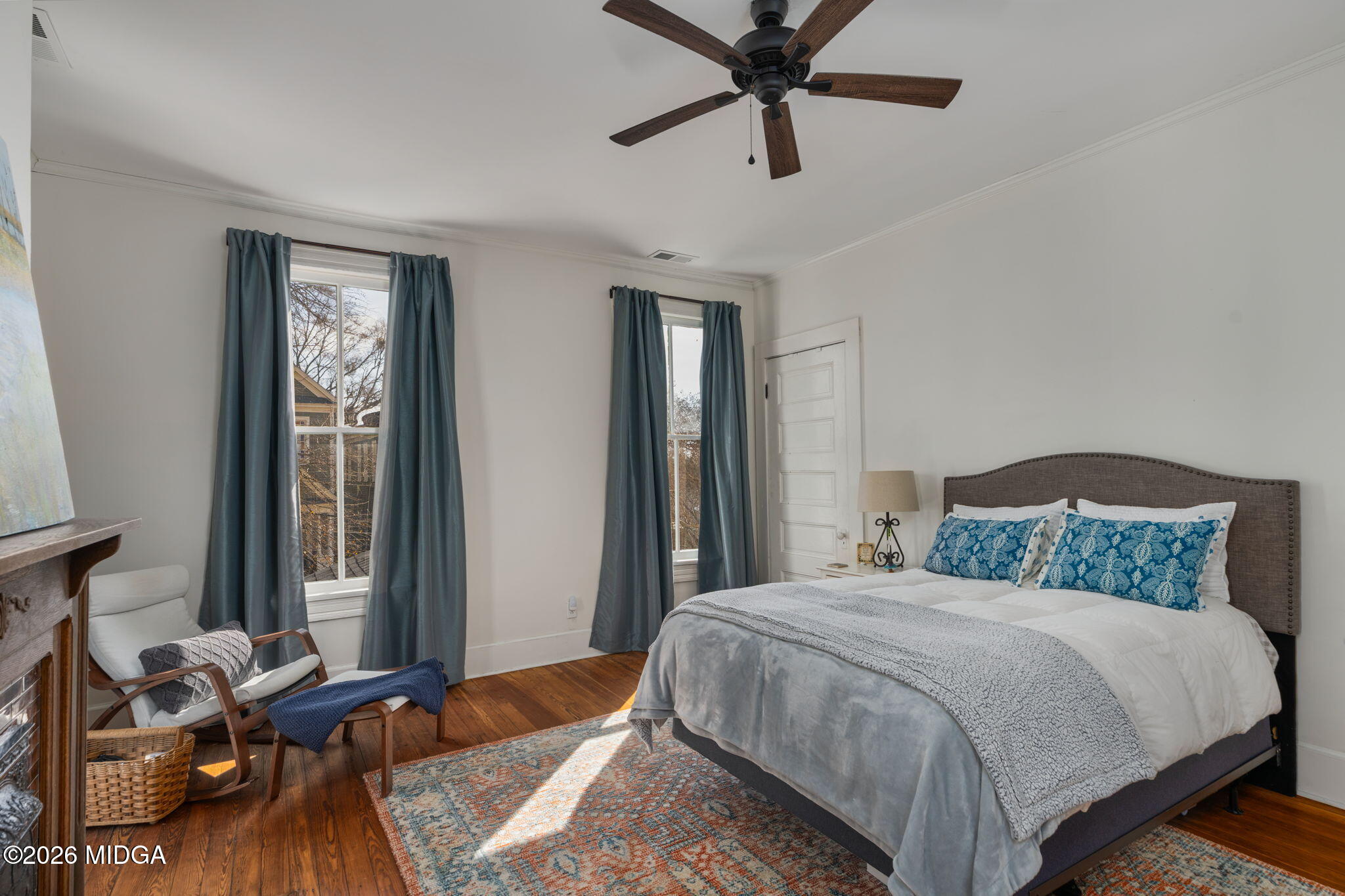 417 Orange Street Macon, GA 31201 - Photo 29 of 49 a bedroom with a bed and wooden floor