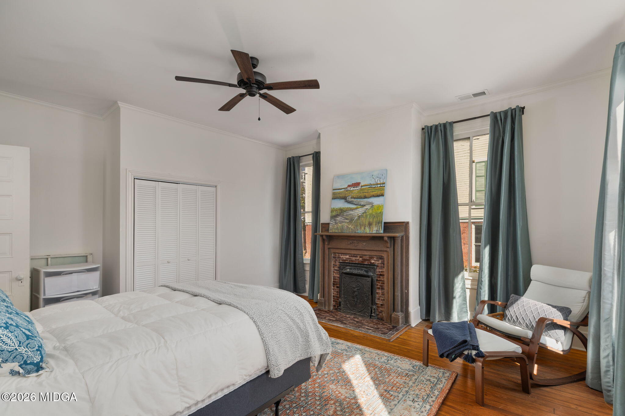 417 Orange Street Macon, GA 31201 - Photo 30 of 49 a bedroom with a bed and wooden floor