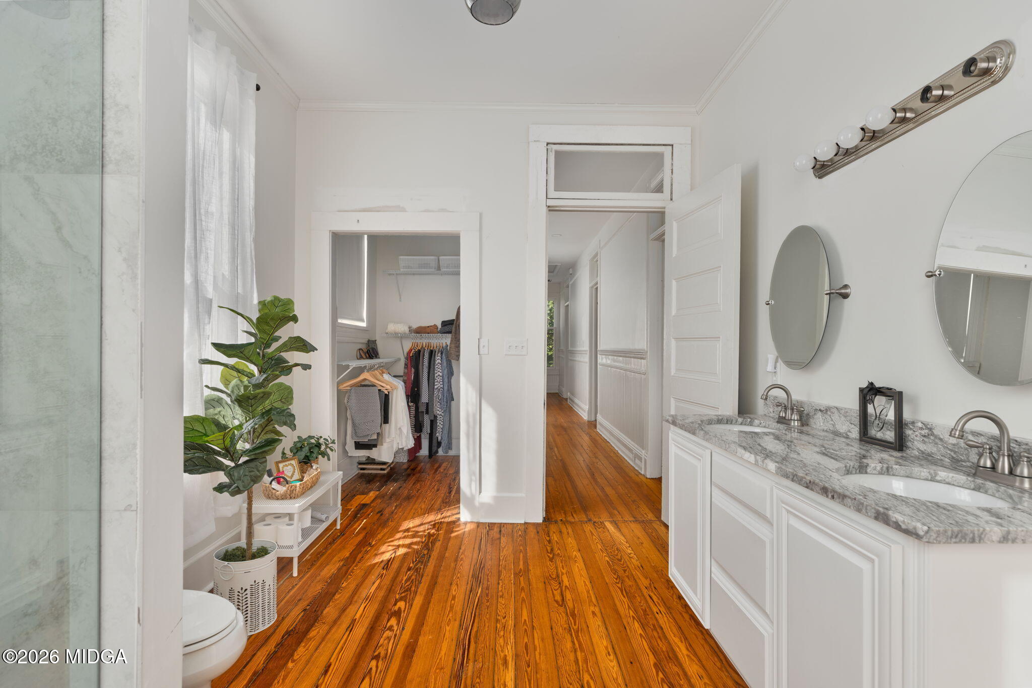 417 Orange Street Macon, GA 31201 - Photo 33 of 49 a spacious bathroom with a granite countertop sink and a mirror