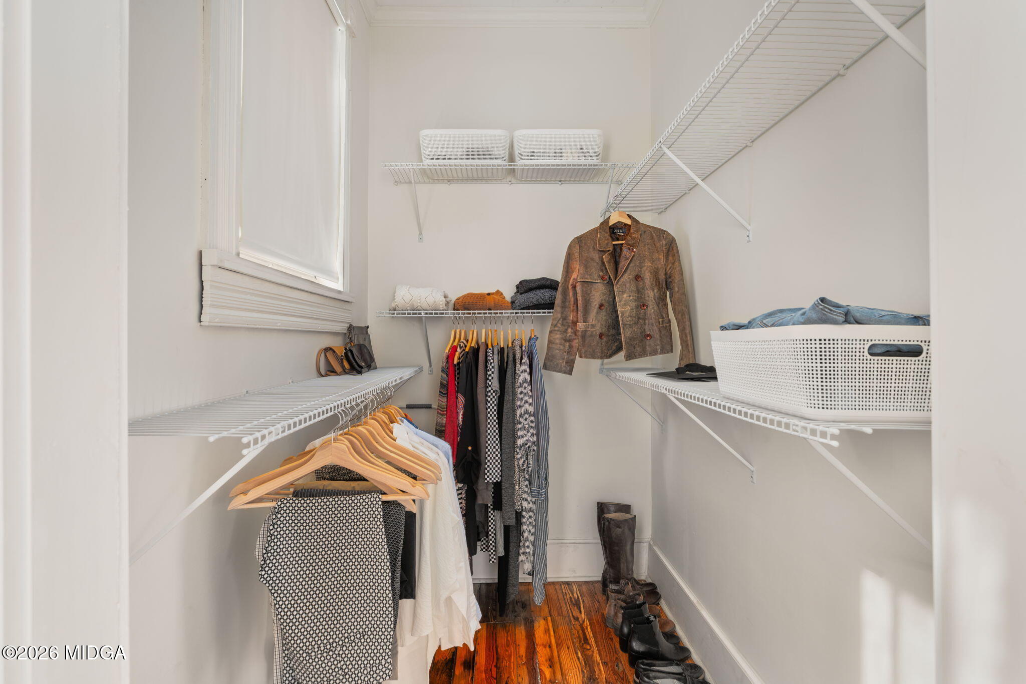 417 Orange Street Macon, GA 31201 - Photo 35 of 49 a view of walk in closet with clothes and shoes