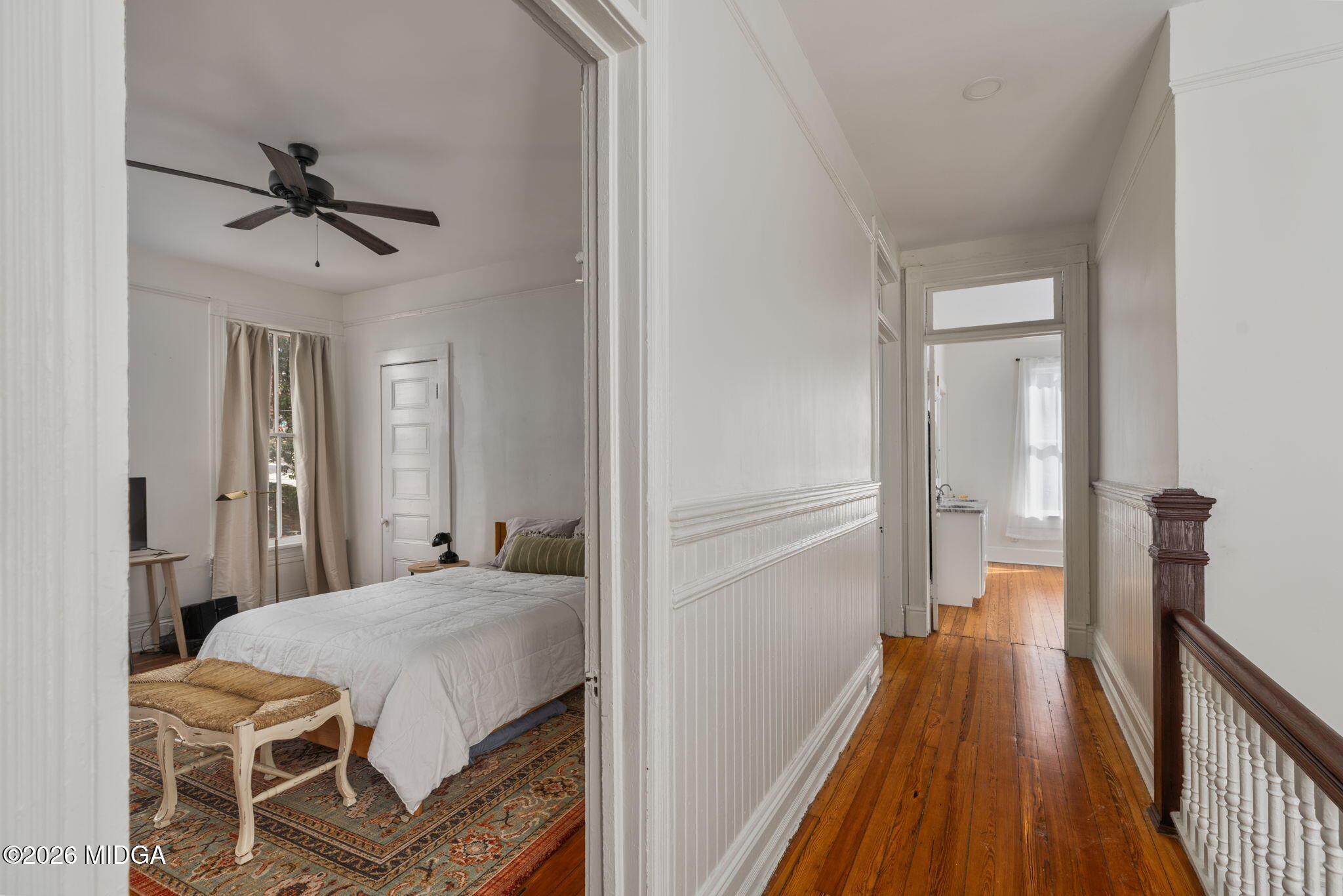 417 Orange Street Macon, GA 31201 - Photo 36 of 49 a bedroom with a bed and wooden floor
