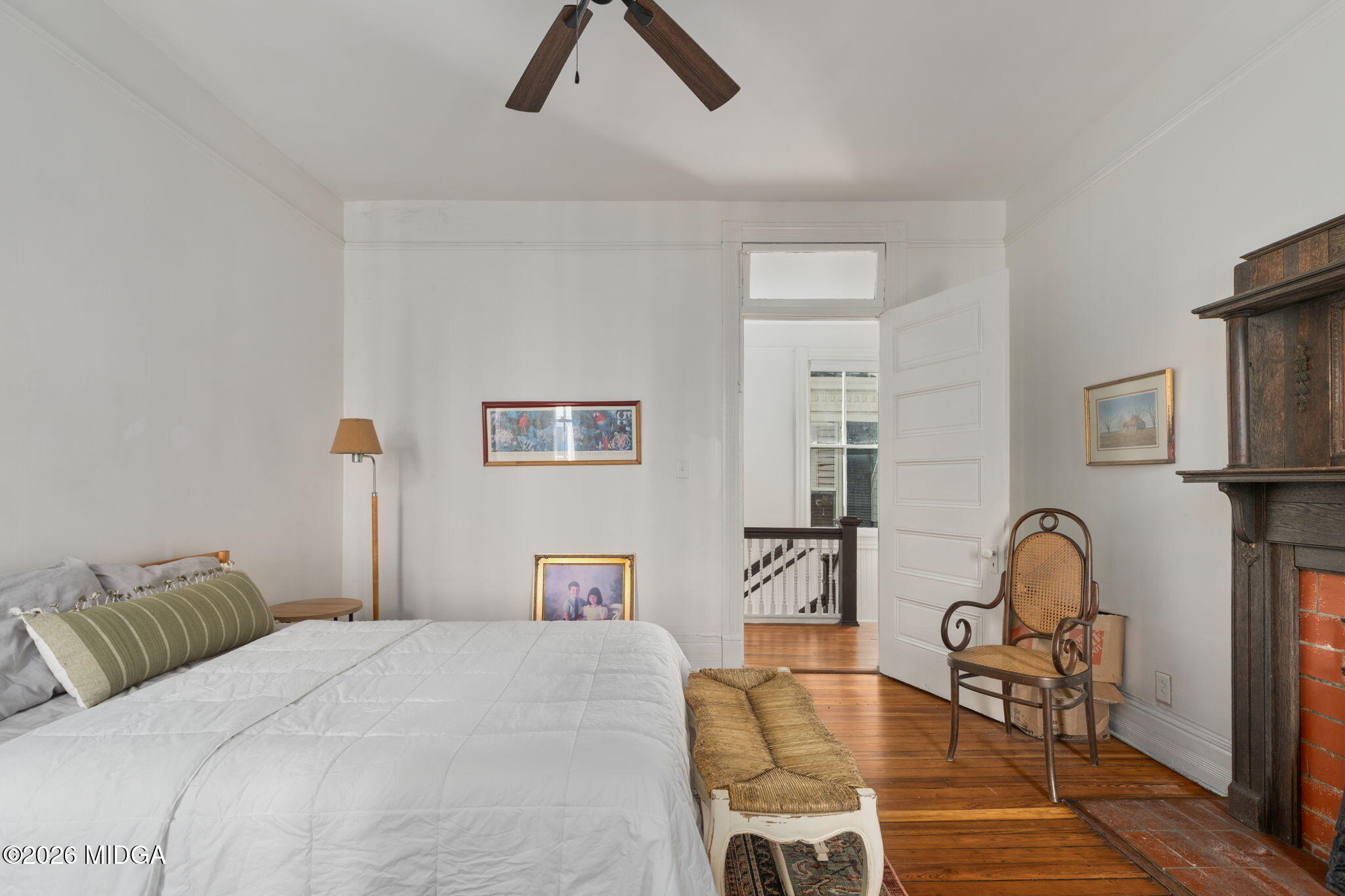 417 Orange Street Macon, GA 31201 - Photo 38 of 49 a bedroom with a bed and a chair