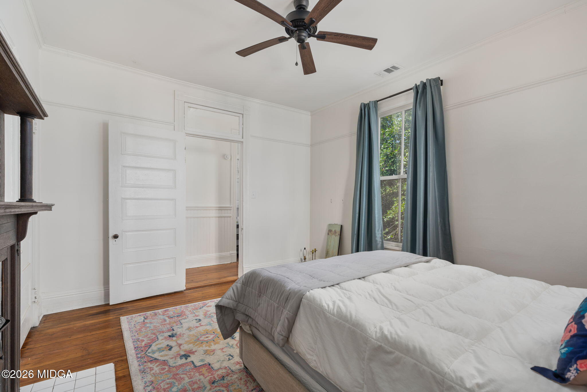 417 Orange Street Macon, GA 31201 - Photo 40 of 49 a bedroom with a bed and a rug