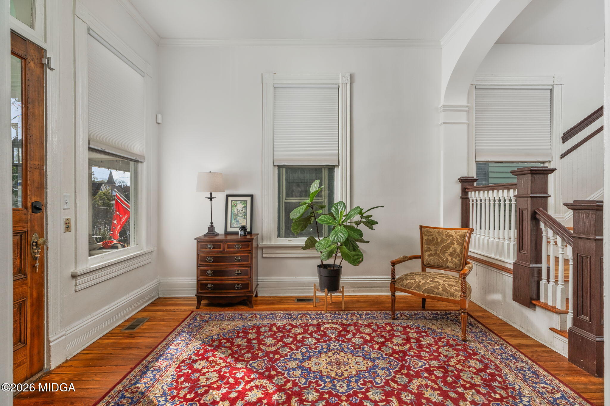 417 Orange Street Macon, GA 31201 - Photo 7 of 49 a living room with furniture and a stairs