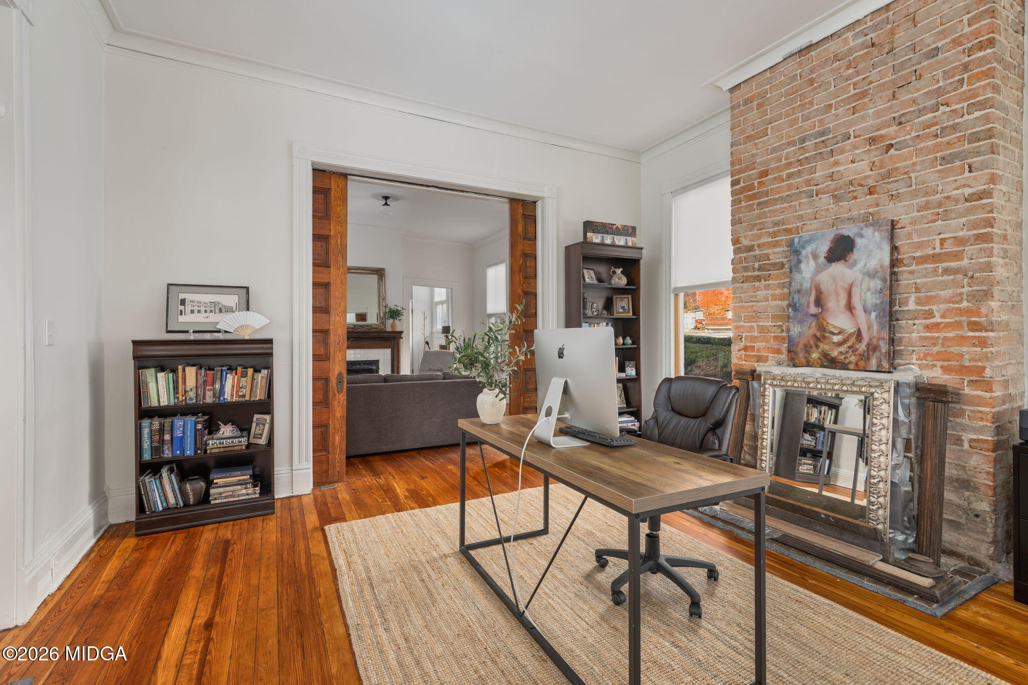 417 Orange Street Macon, GA 31201 - Photo 9 of 49 a living room with furniture and a book shelf