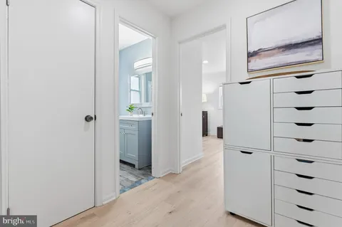 a view of closet with cabinet