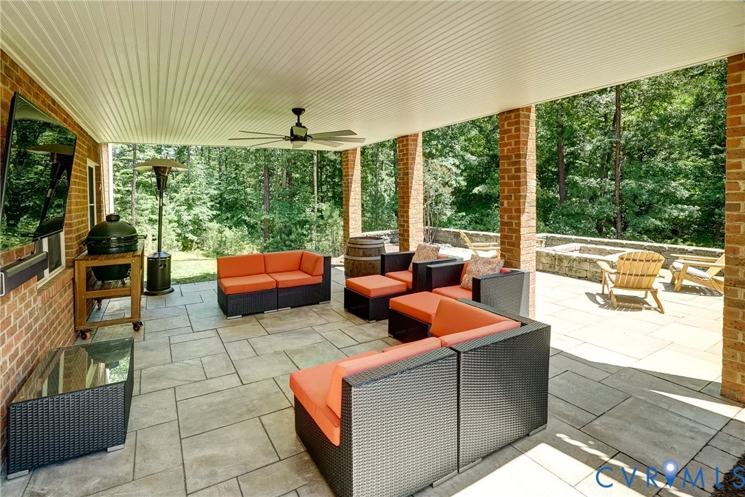 1295 Hermitage Road Manakin-Sabot, VA 23103 - Photo 13 of 55 a outdoor space with patio the couches and a dining table with garden view