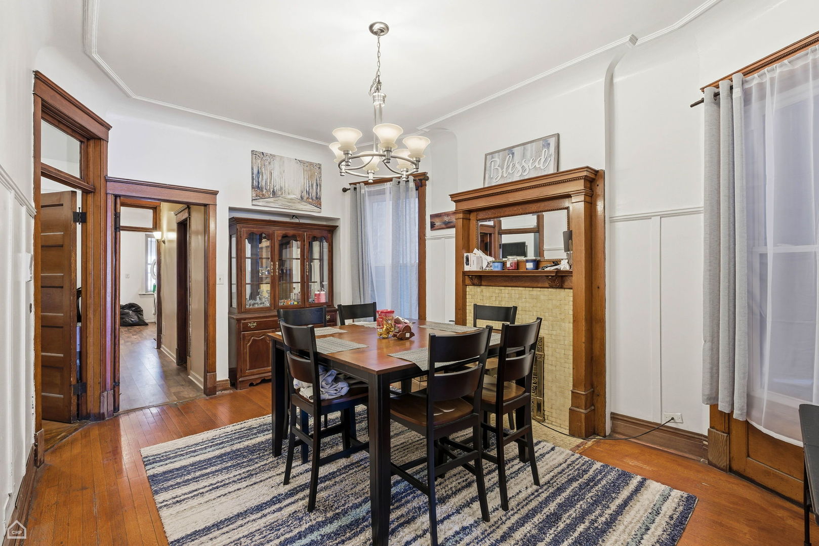 4736 South Prairie Avenue Chicago, IL 60615 - Photo 13 of 39 a view of a dining room with furniture window and wooden floor