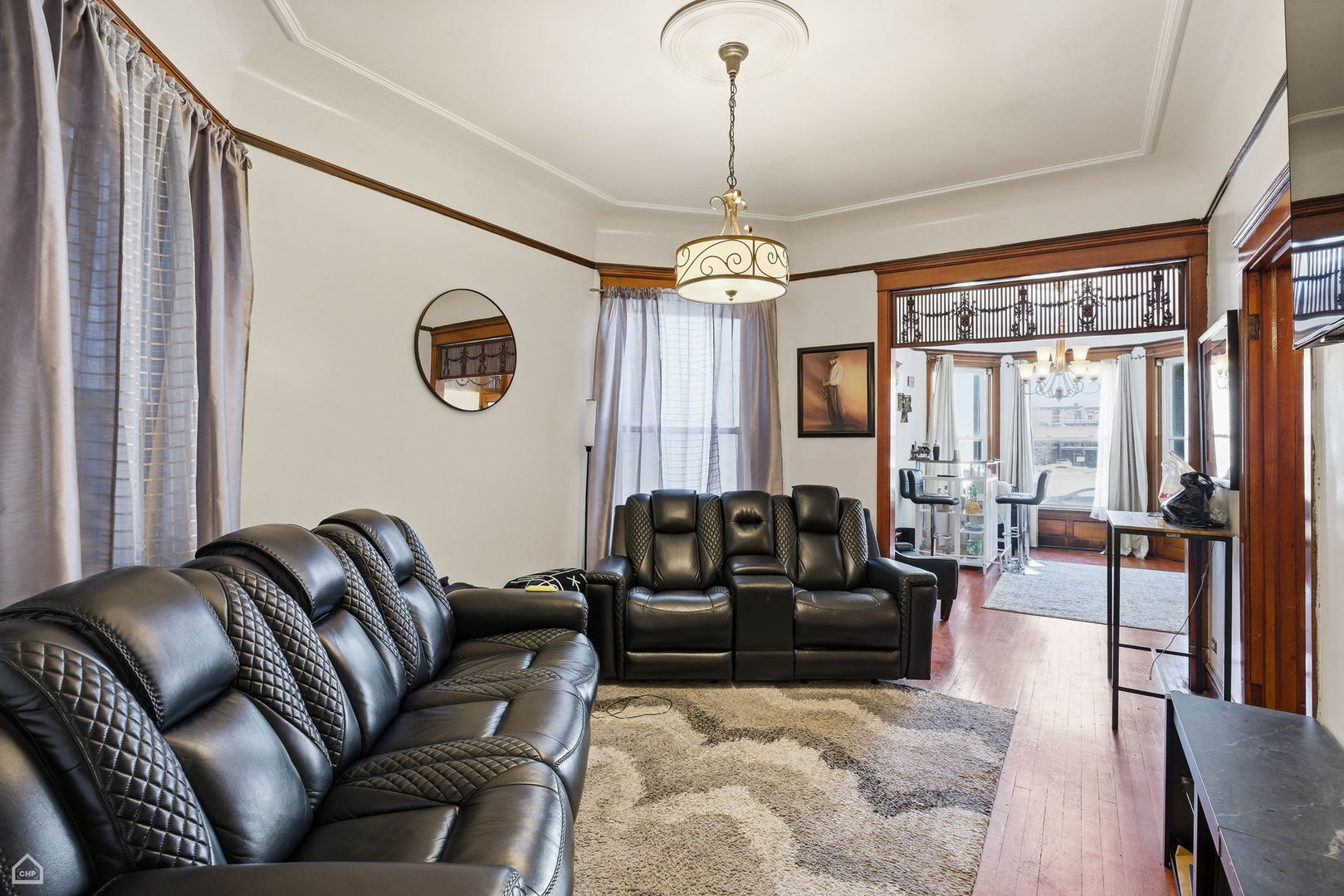 4736 South Prairie Avenue Chicago, IL 60615 - Photo 14 of 39 a living room with furniture ceiling fan and a rug