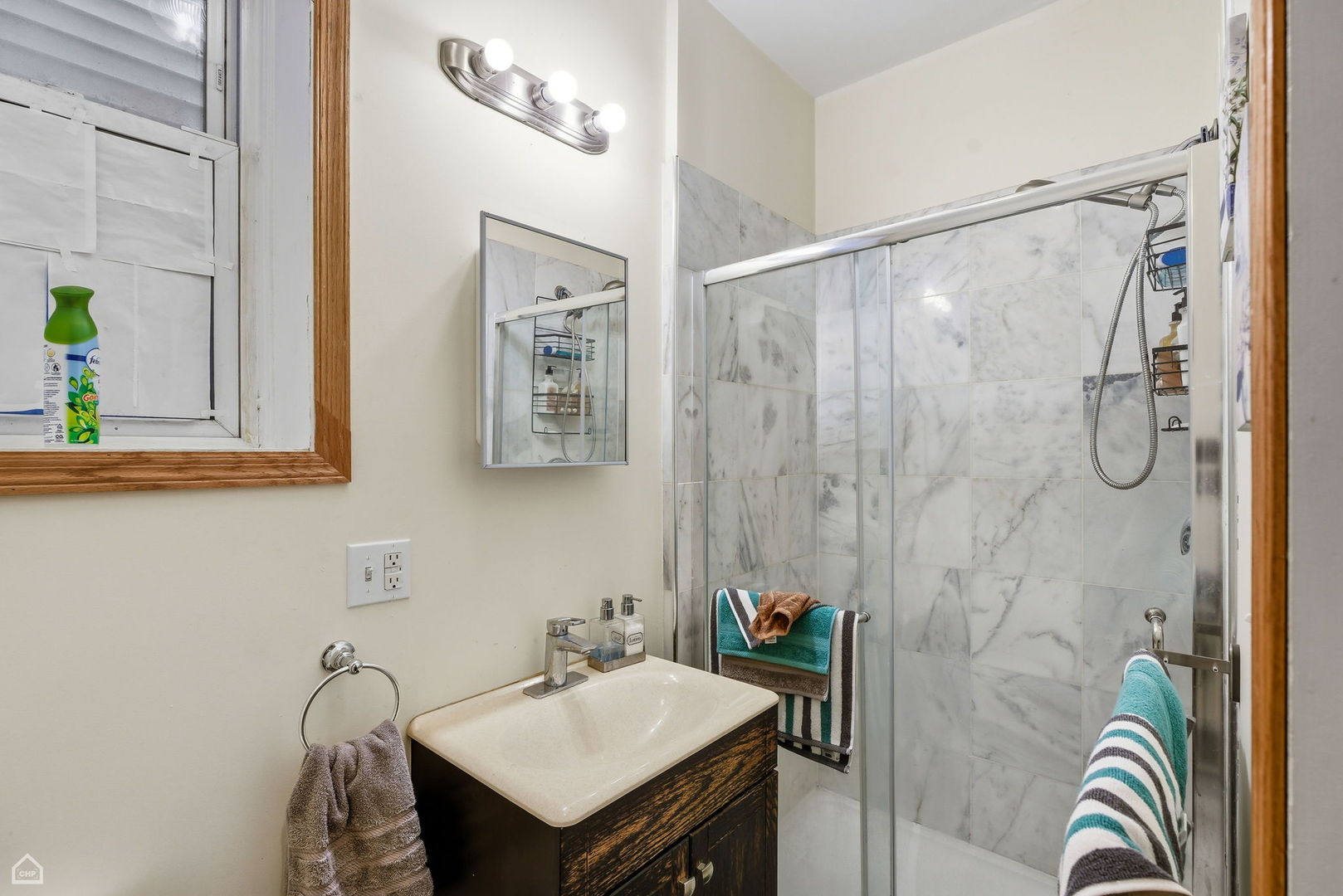 4736 South Prairie Avenue Chicago, IL 60615 - Photo 16 of 39 a bathroom with a sink and mirror
