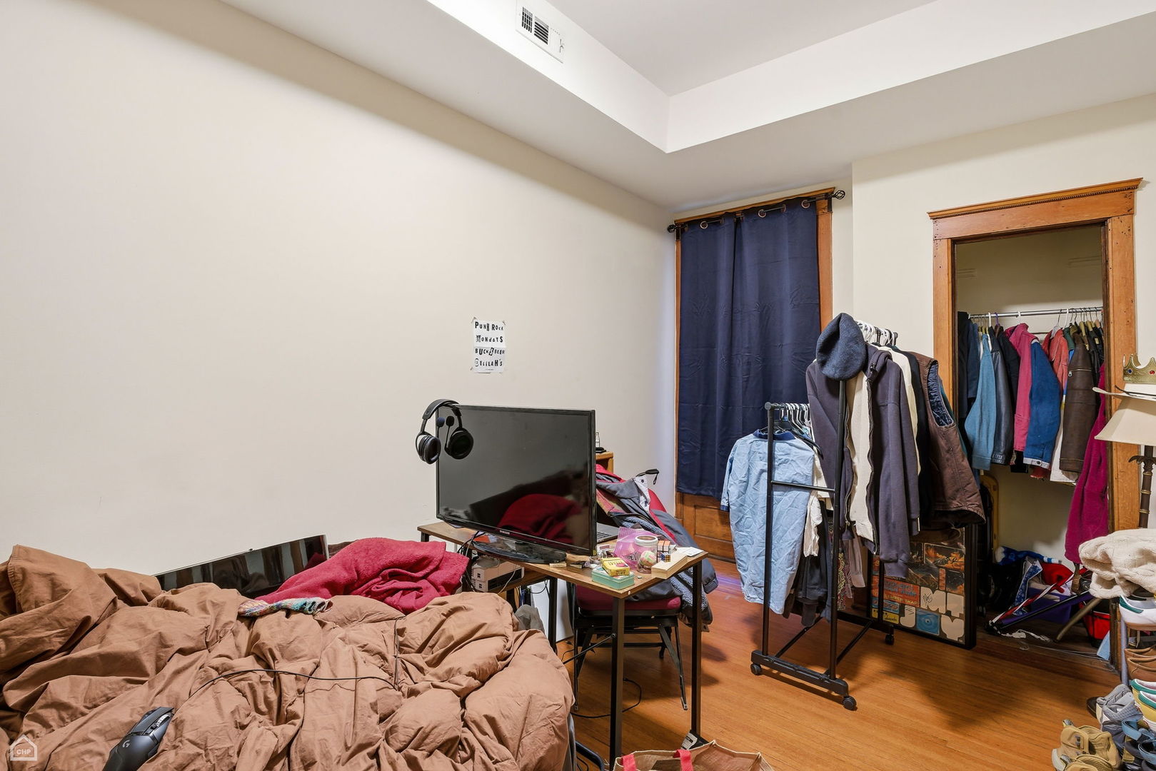 4736 South Prairie Avenue Chicago, IL 60615 - Photo 28 of 39 a bed sitting in a bedroom next to a window