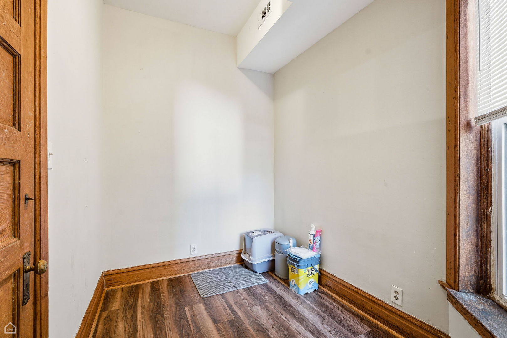 4736 South Prairie Avenue Chicago, IL 60615 - Photo 36 of 39 a bathroom with a wooden floor and toilet