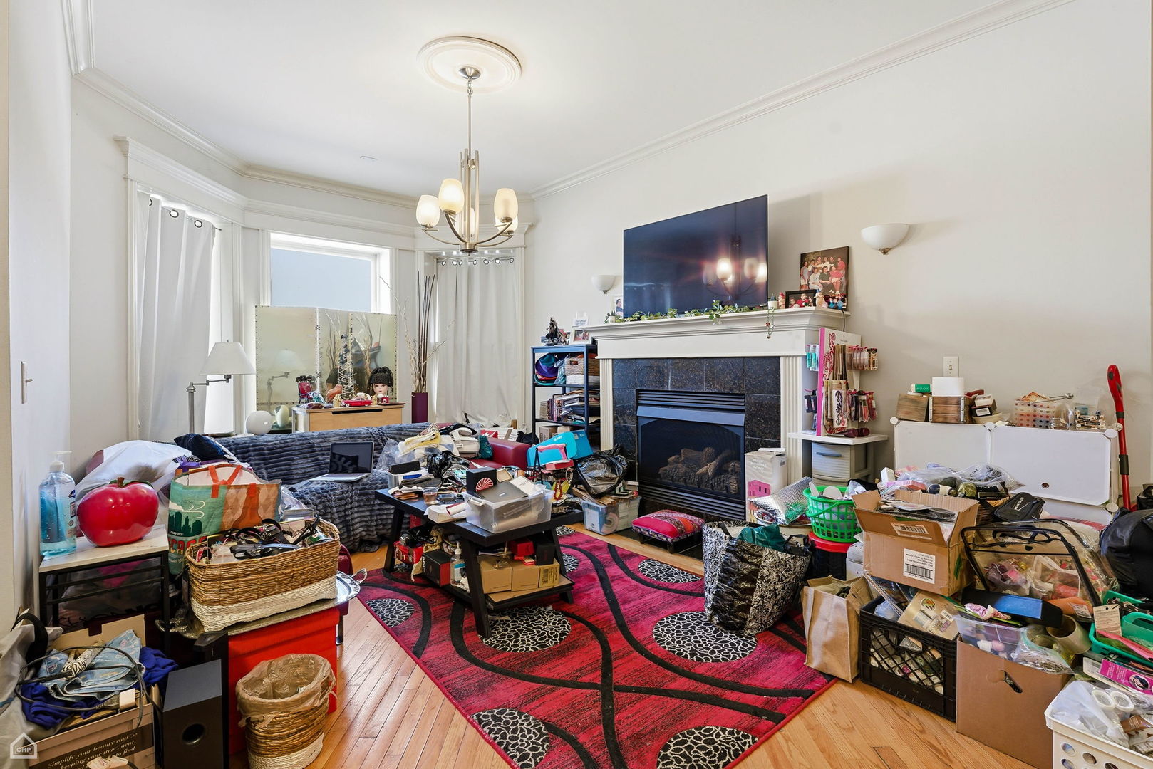 4736 South Prairie Avenue Chicago, IL 60615 - Photo 39 of 39 a living room with lots of furniture a fireplace and a flat screen tv