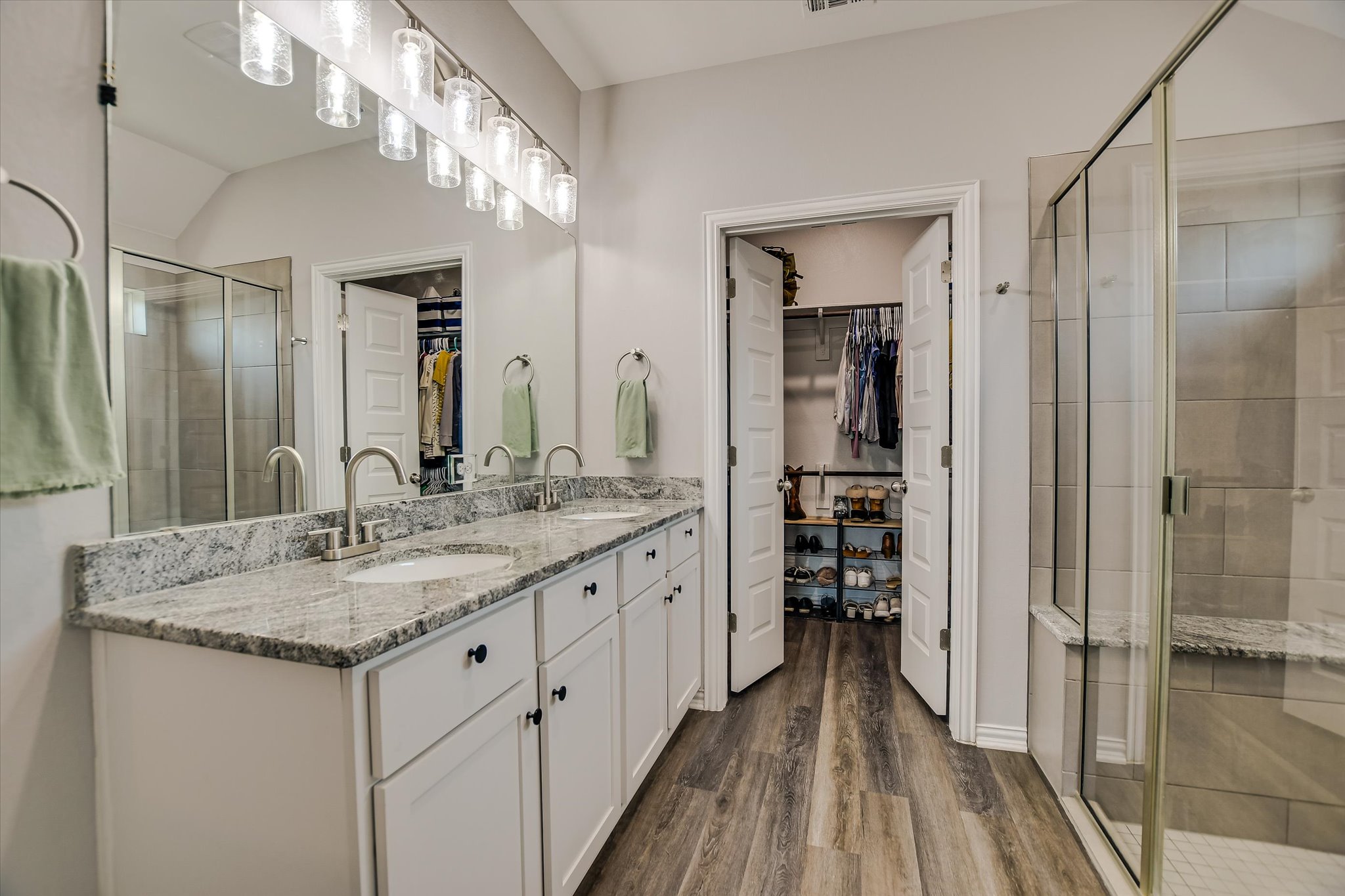 1101 Terrace View Drive Georgetown, TX 78628 - Photo 11 of 20 a bathroom with a granite countertop sink a mirror and a shower