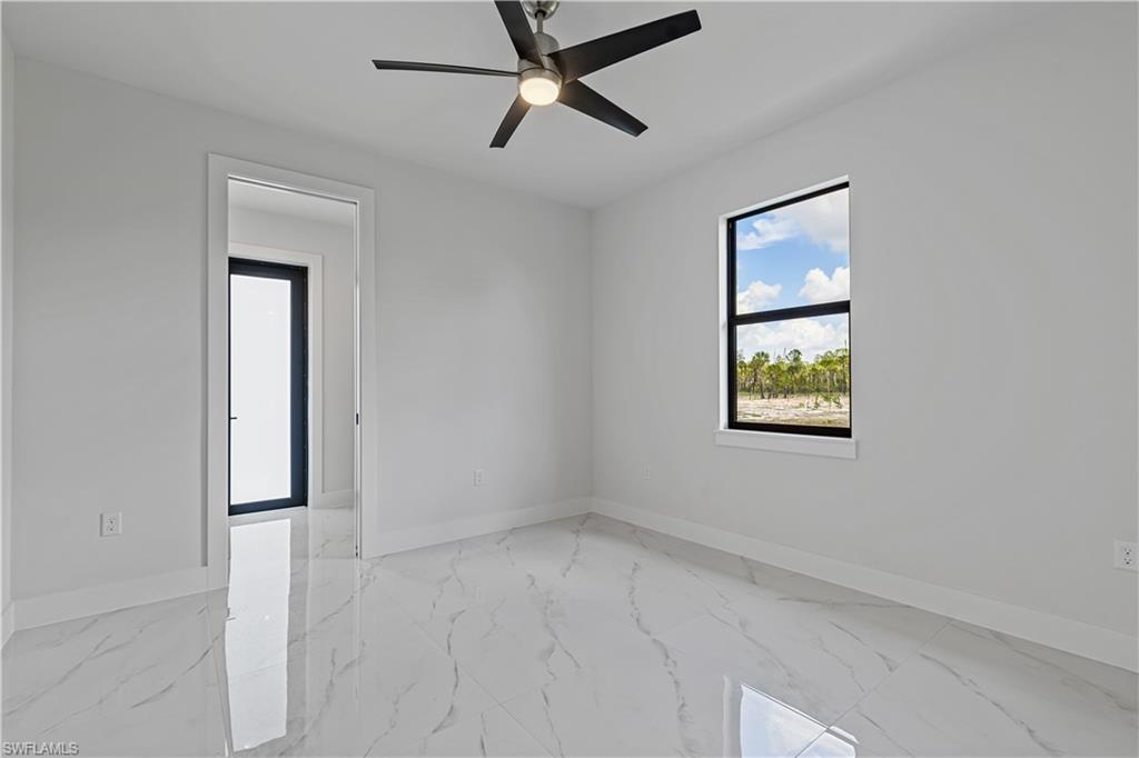 3397 14th Avenue Southeast Naples, FL 34117 - Photo 20 of 28 an empty room with windows and closet